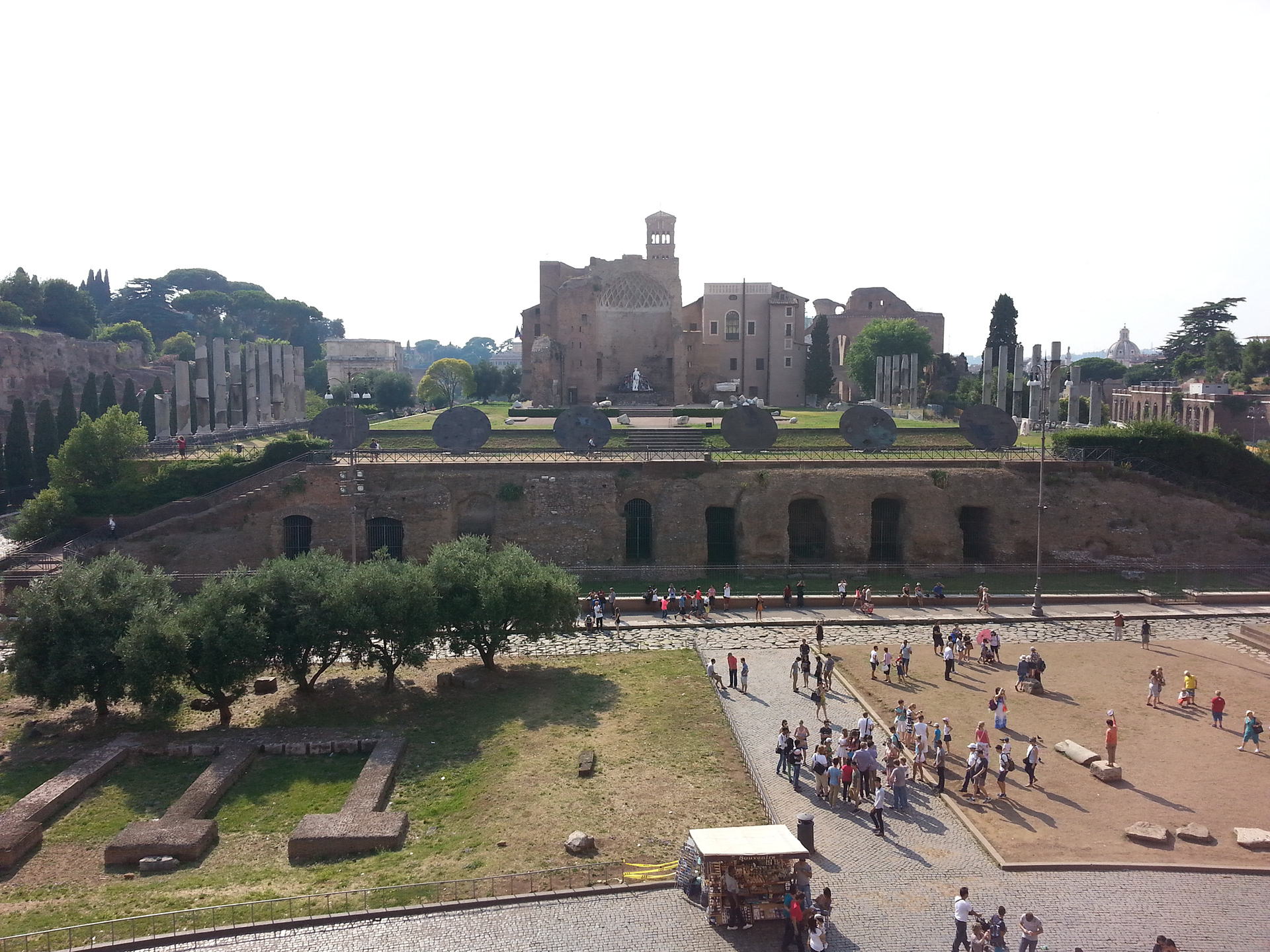From the top level of the Colosseum, you get a beautiful view of the city. Directly west is the Temple of Venus and Roma, thought to be the largest temple in ancient Rome. Built between 135-141 at the initiation of Hadrian, it was destroyed by an earthquake in the 9th century. 