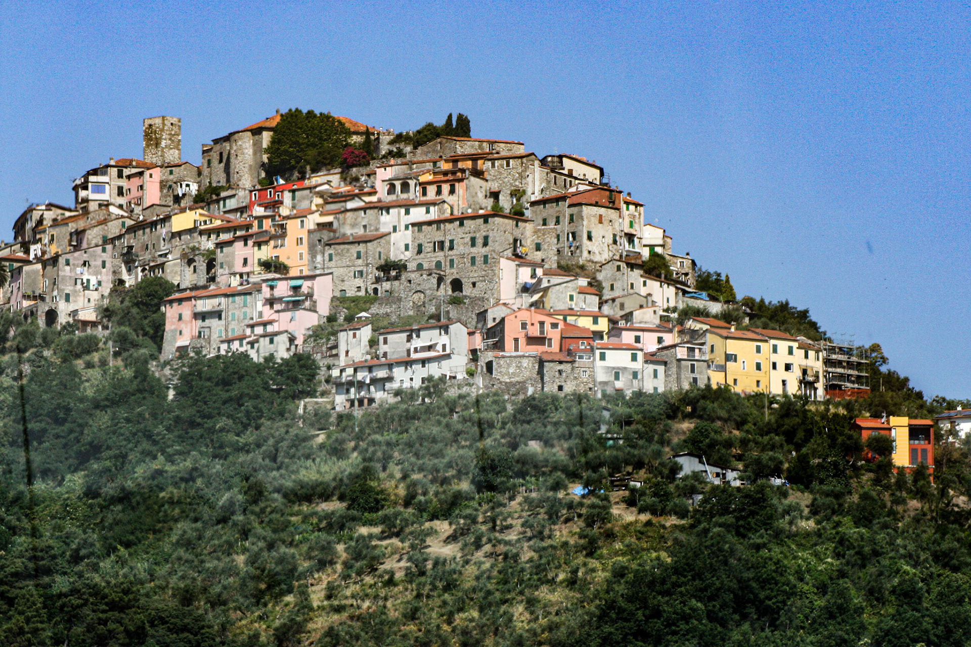 Ancient villages dot the mountainside as we travel towards Manarola, Cinque Terre, Italy. 