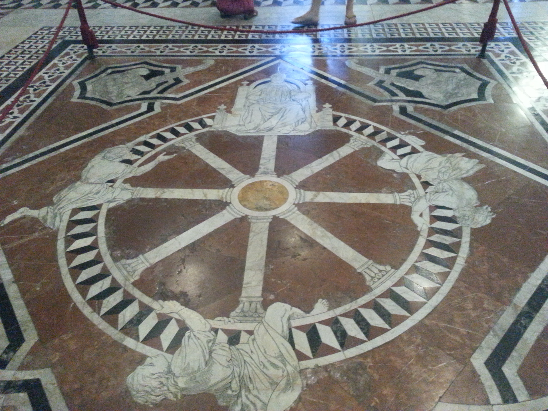 Details of the marble floor:  Ruota della Fortuna (“The Wheel of Fortune”) which communicates the mutability of fortune and is aimed at encouraging its viewers to turn to faith and work rather than relying on chance. 