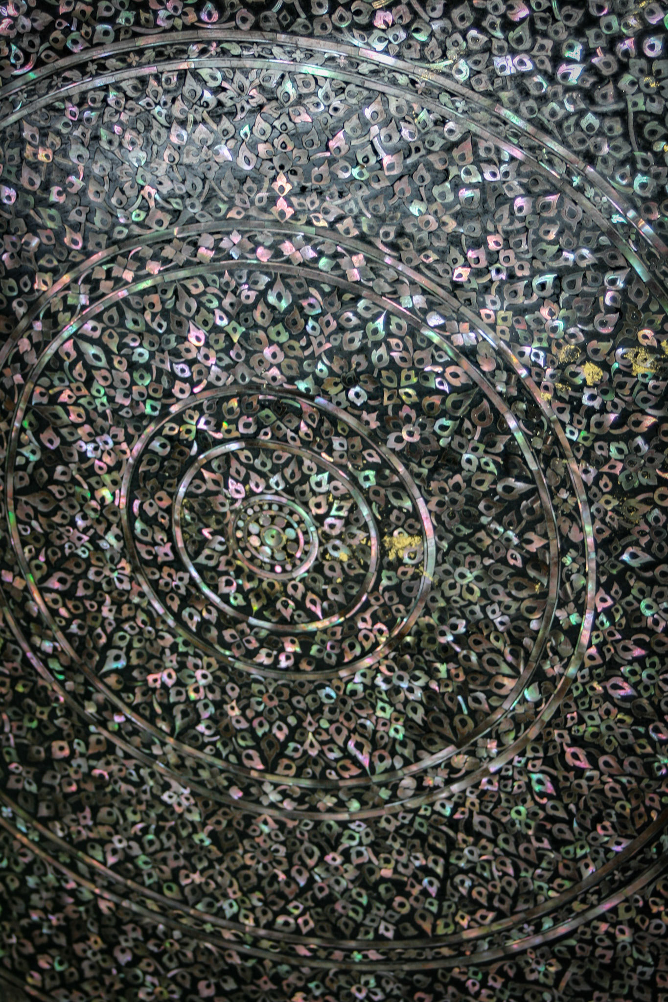 The soles of the feet are inlaid with mother-of-pearl which depict the 108 auspicious signs of the Buddha.