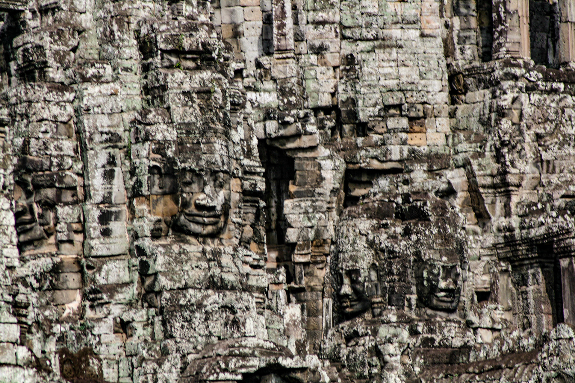 The Bayon is a richly decorated Khmer temple related to Buddhism at Angkor in Cambodia. Built in the late 12th or early 13th century as the state temple of the King Jayavarman VII), the Bayon stands at the center of Jayavarman's capital, Angkor Thom.