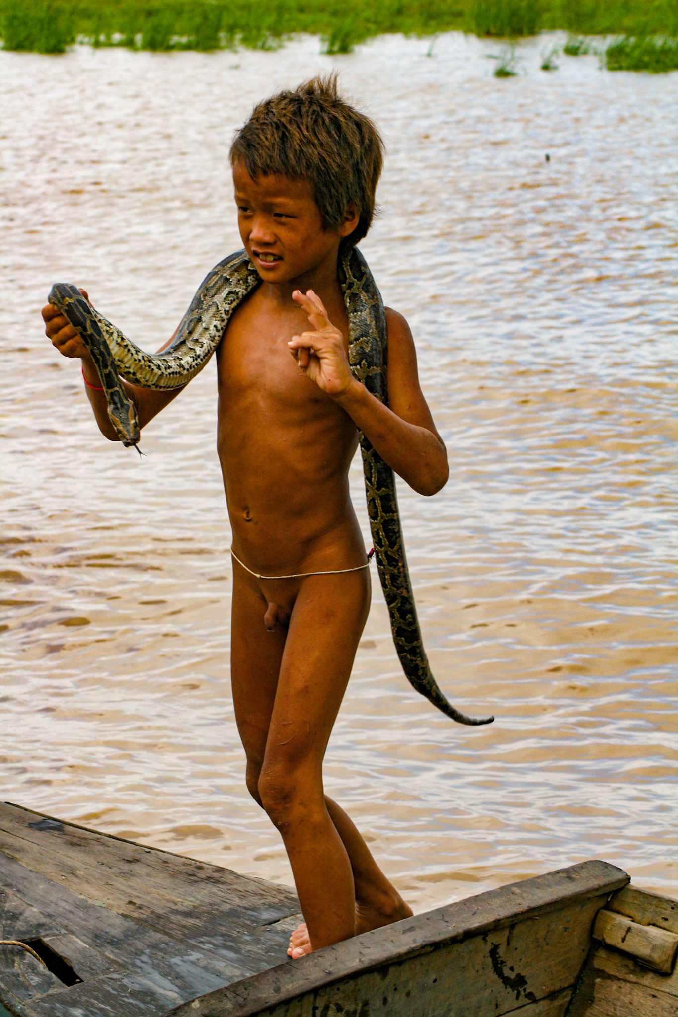 The locals have sometimes taken to bringing their young children up to the tourist boats to beg for coins. Some show off the biodiversity of the region—much to the chagrin of some tourists! 