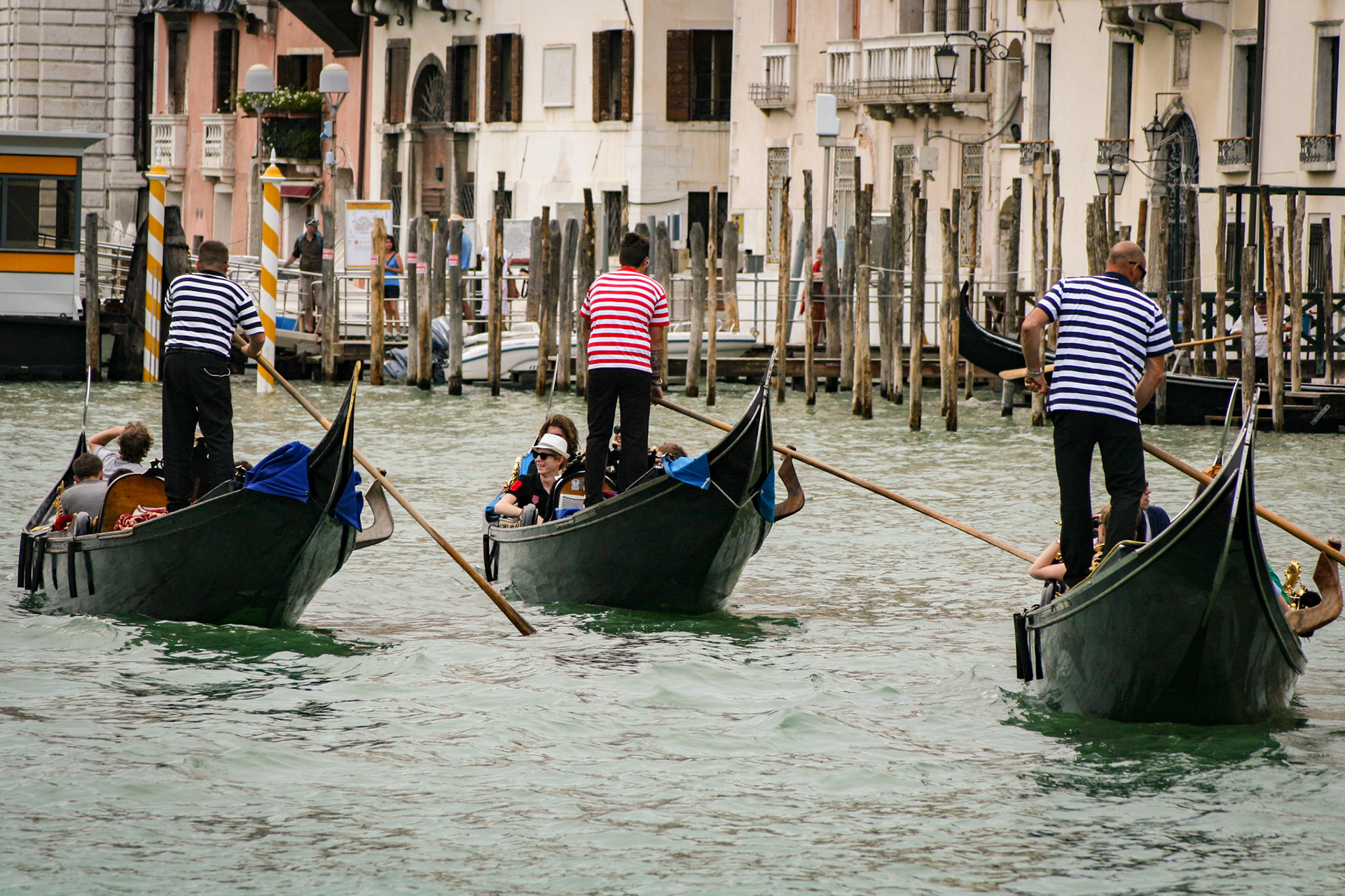 Gondoliers on the Grand Canal. - Venice