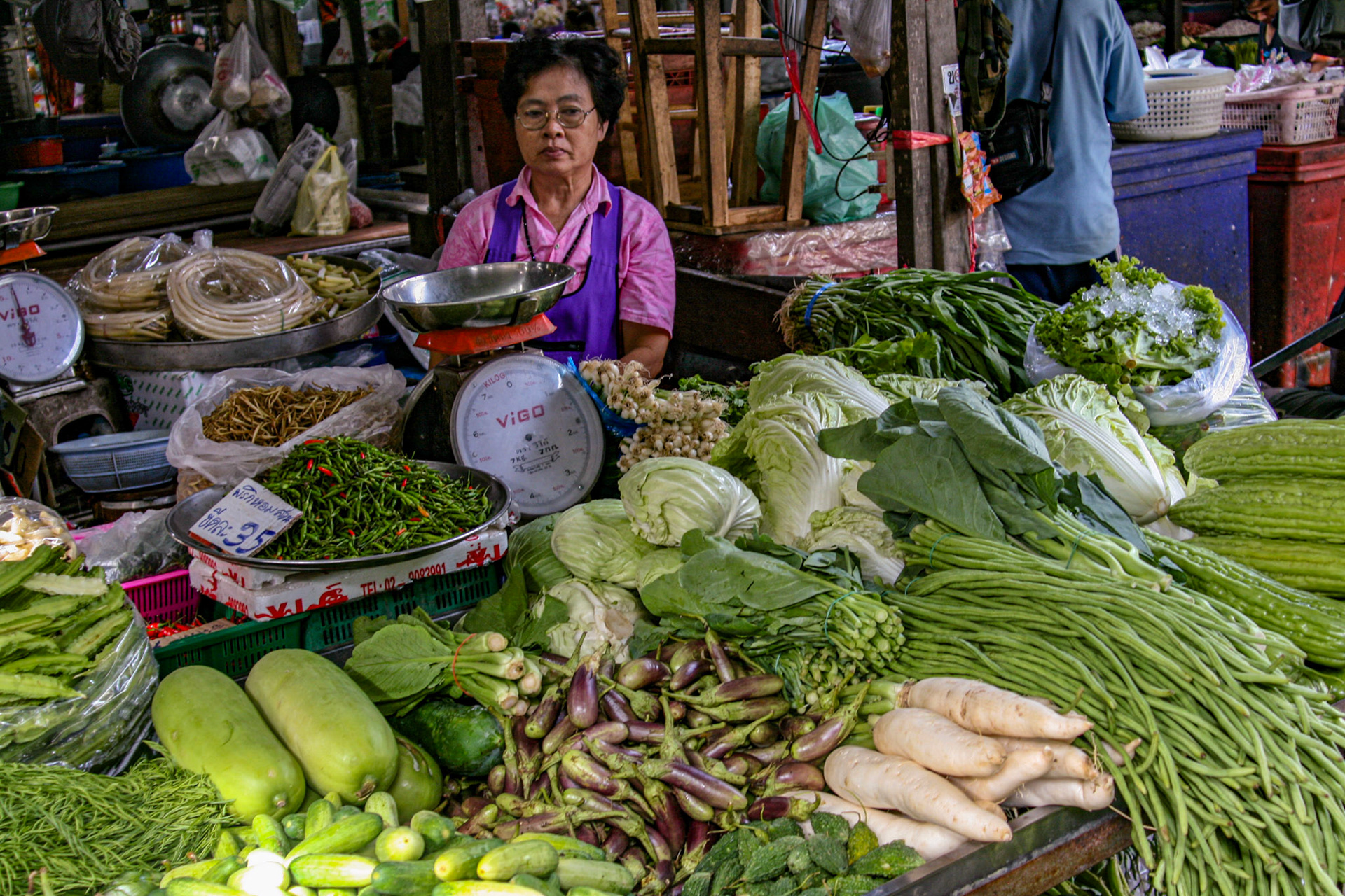 Bountiful harvests of vegetables and greens adorn table tops.