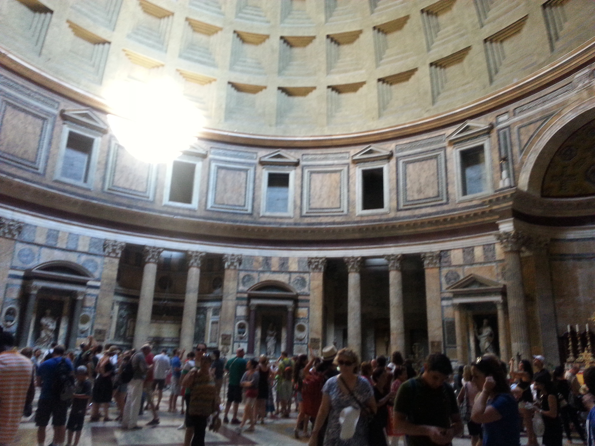 The Pantheon was originally built as a Roman temple but was later converted to a Catholic Basilica in 608 A.D. and consecrated as Sancta Maria ad Martyres (Saint Mary and the Martyrs). Its interior is richly decorated in polychrome marble and adorned with religious art.  
