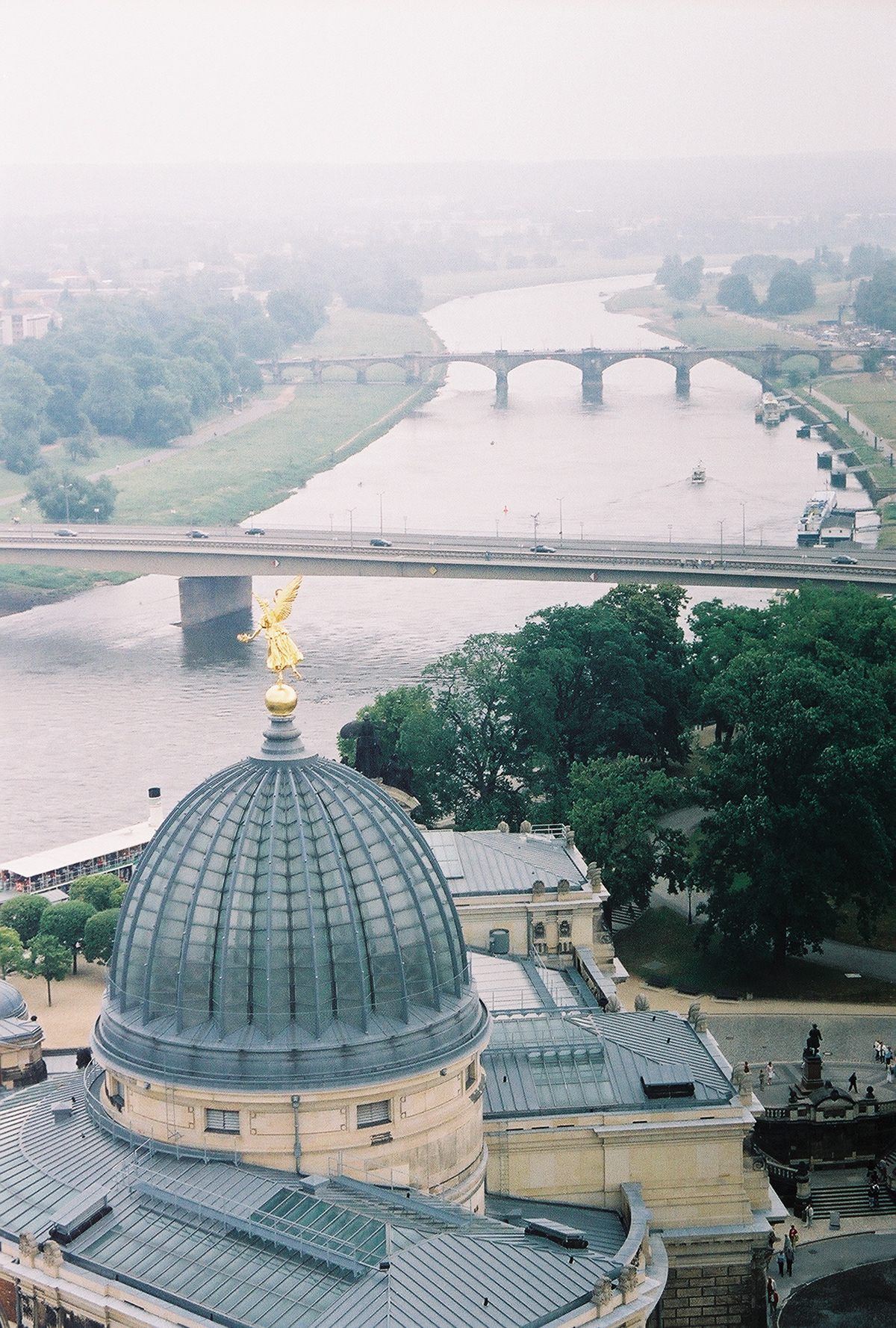 A view of the Elbe River with the glass dome of the Royal Academy of Arts building in the foreground - Dresden