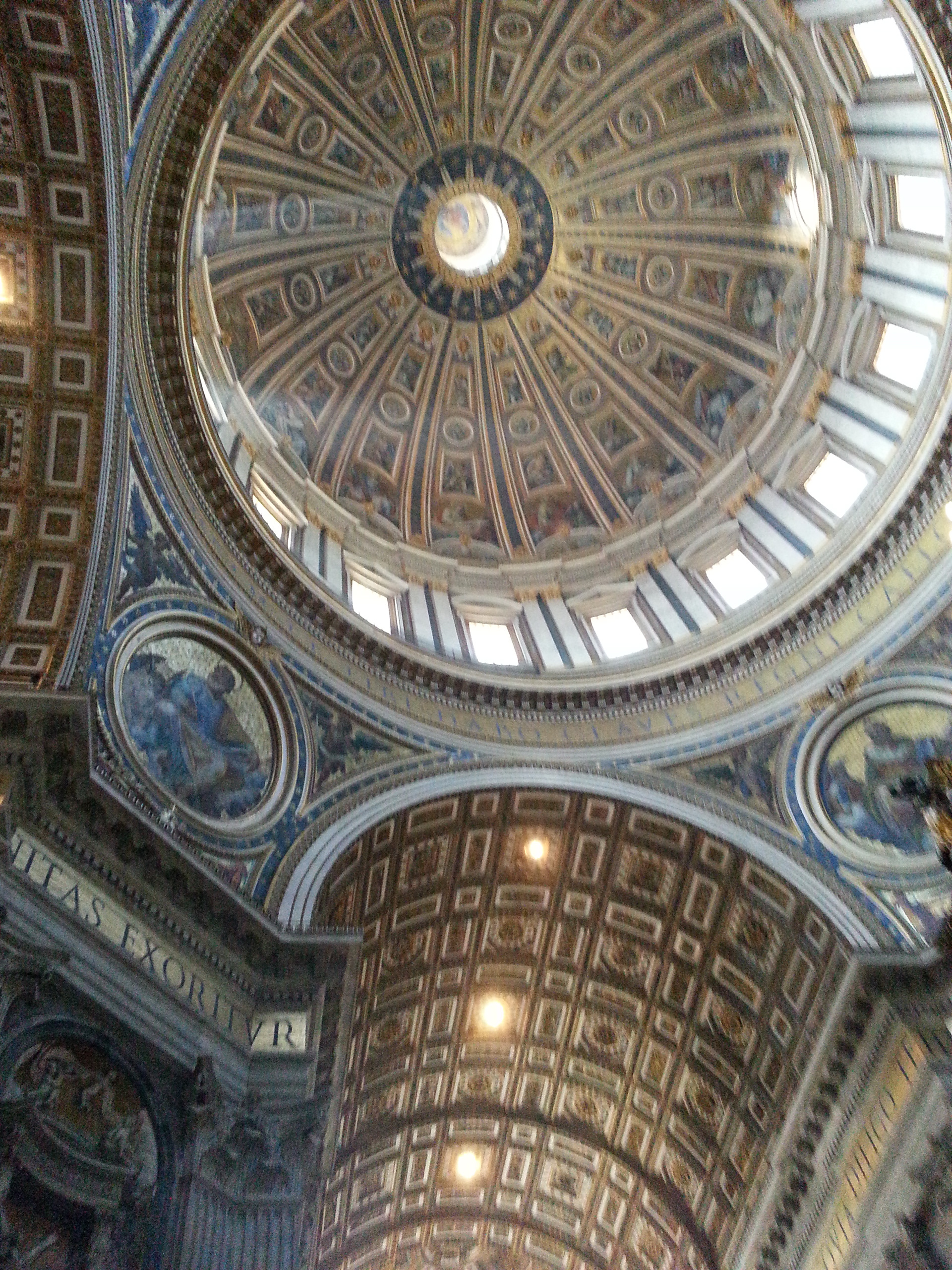 The baldachin is at the center of the crossing, and directly under the dome of the basilica. 