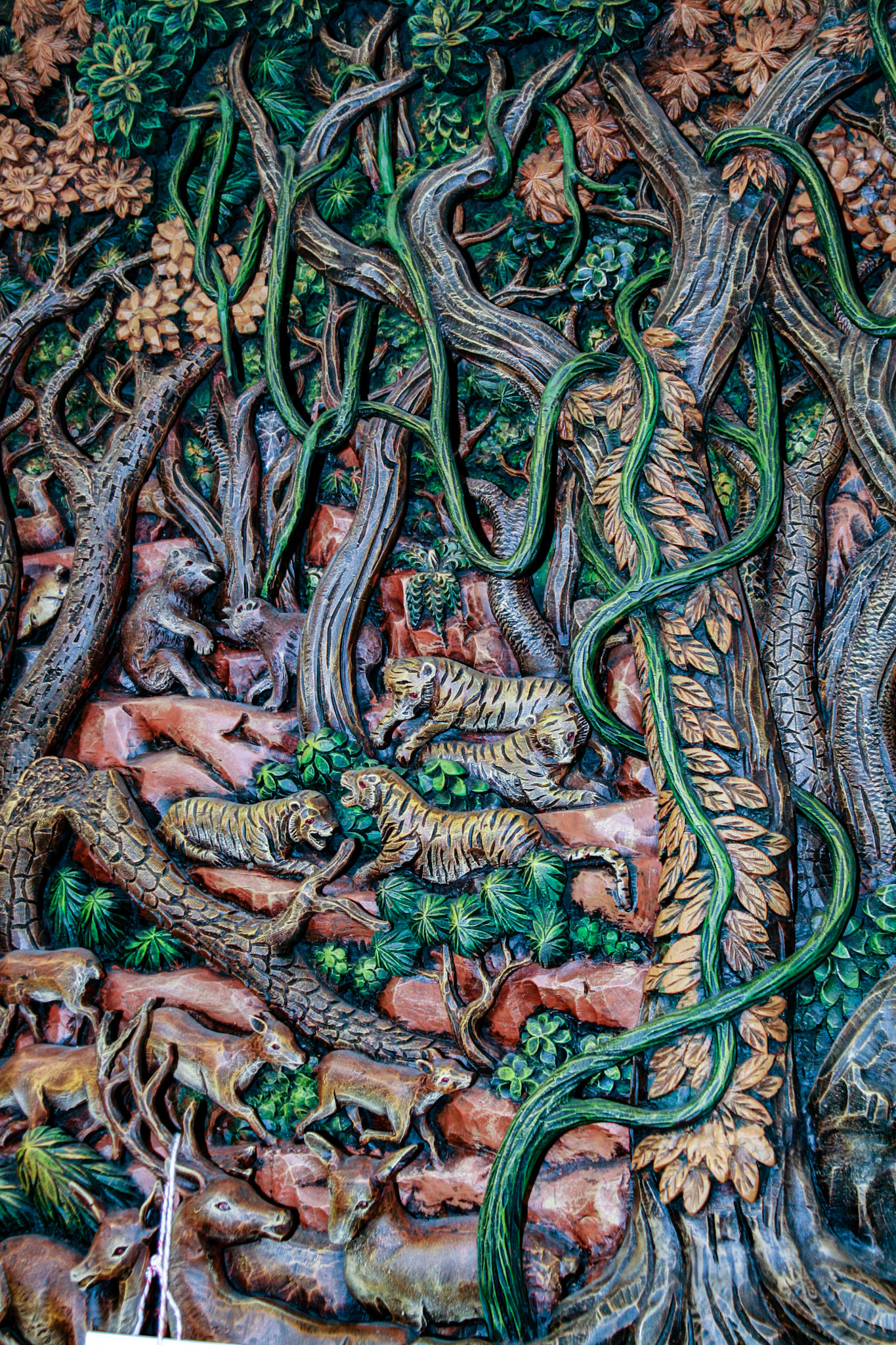 Wood carving at a Teakwood art factory.