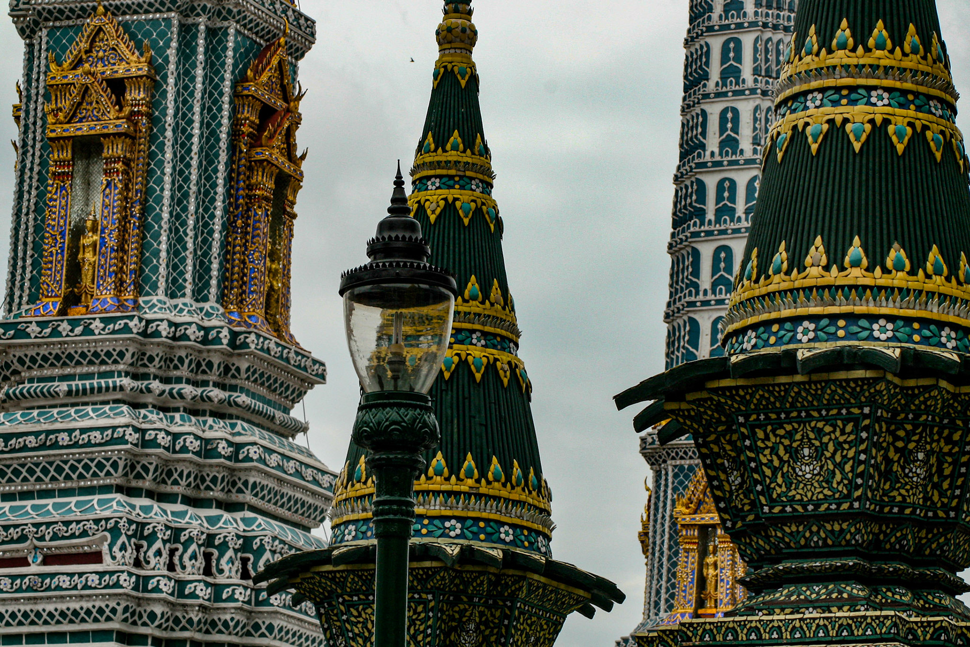 Four Towers Called Prangs or Chedi at Grand Palace in Bangkok, Thailand