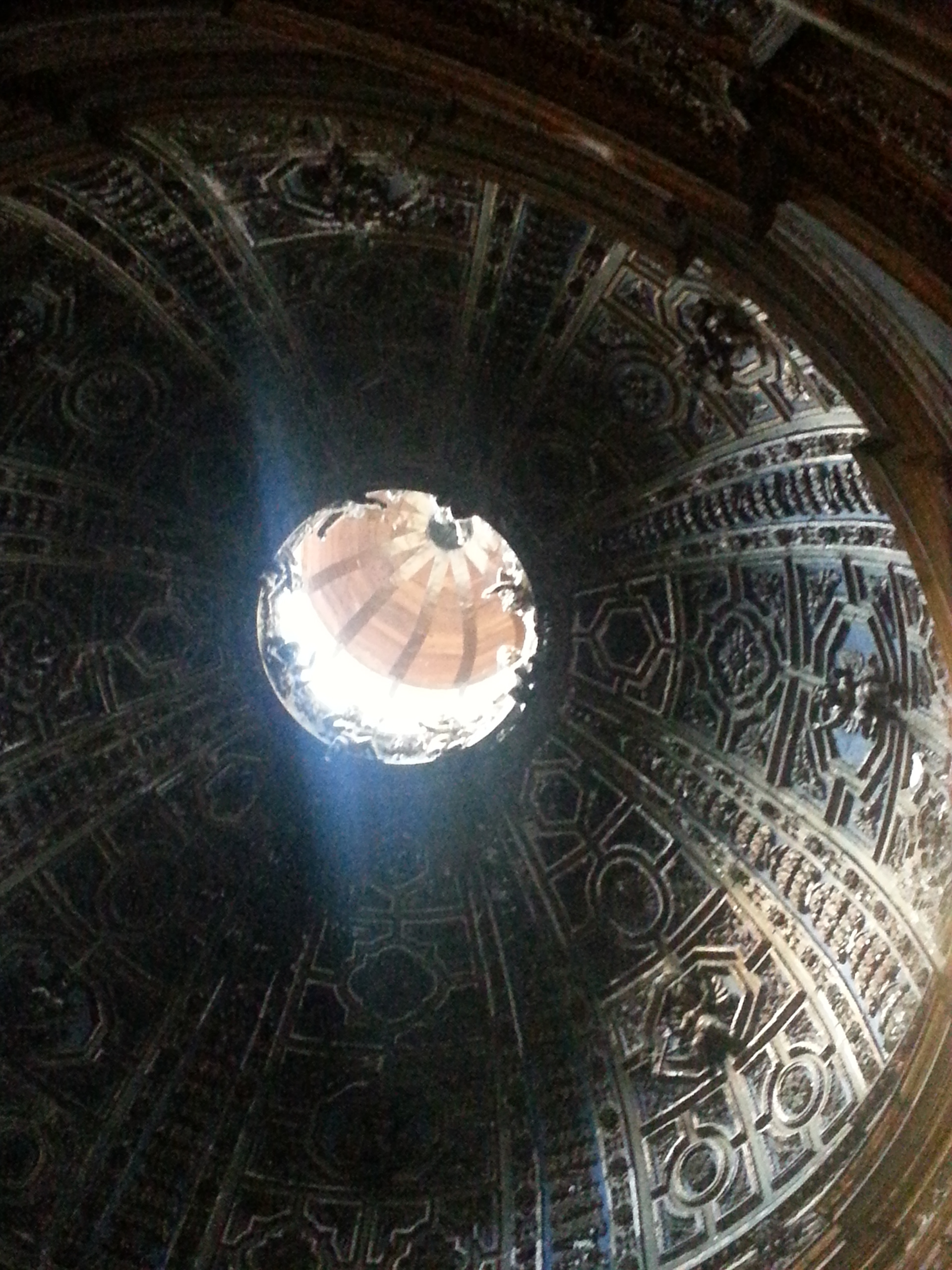 The gilded stucco dome of the Chapel of St. John the Baptist in the North (left) transept.