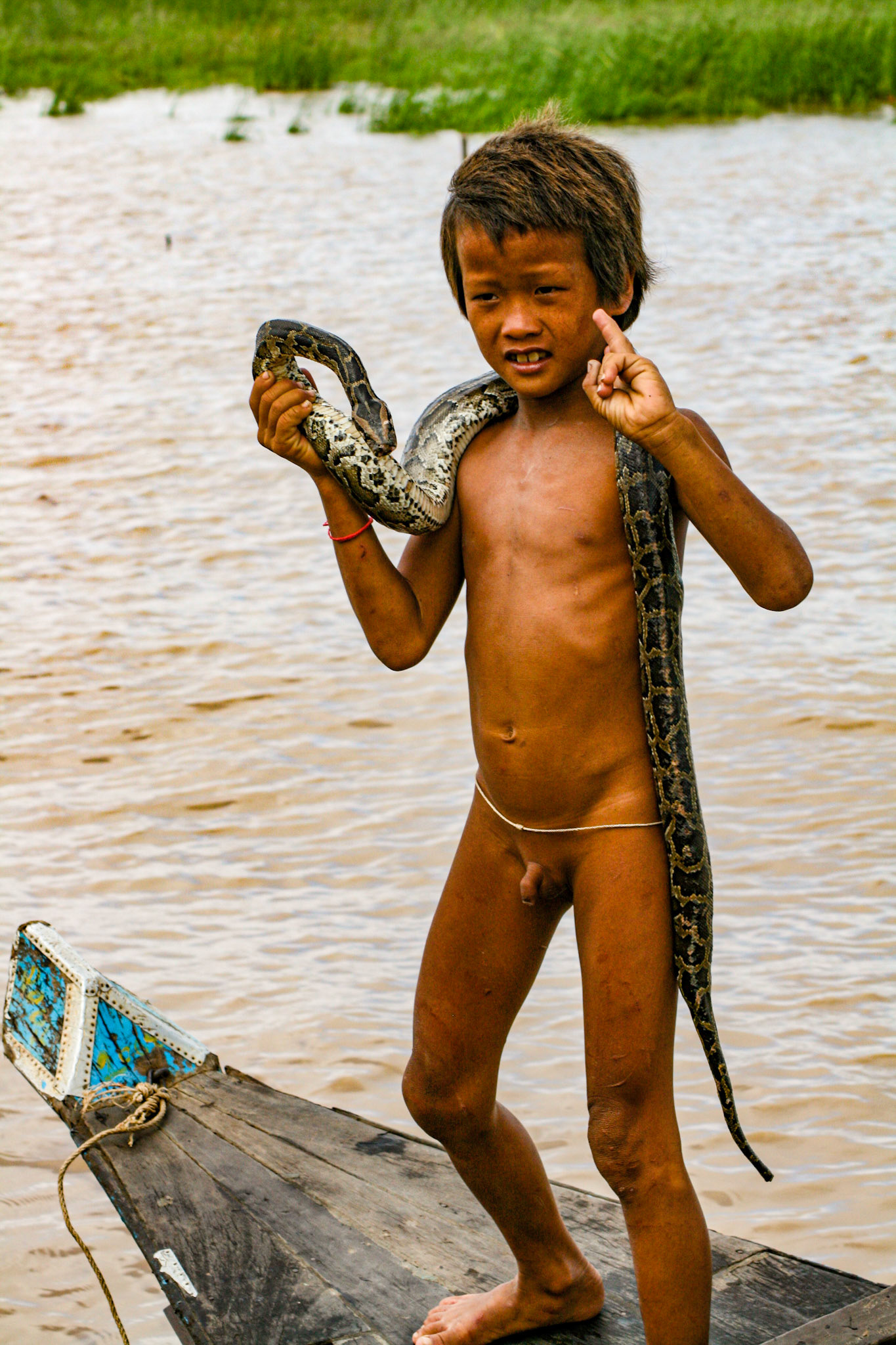The locals have sometimes taken to bringing their young children up to the tourist boats to beg for coins. Some show off the biodiversity of the region—much to the chagrin of some tourists! 