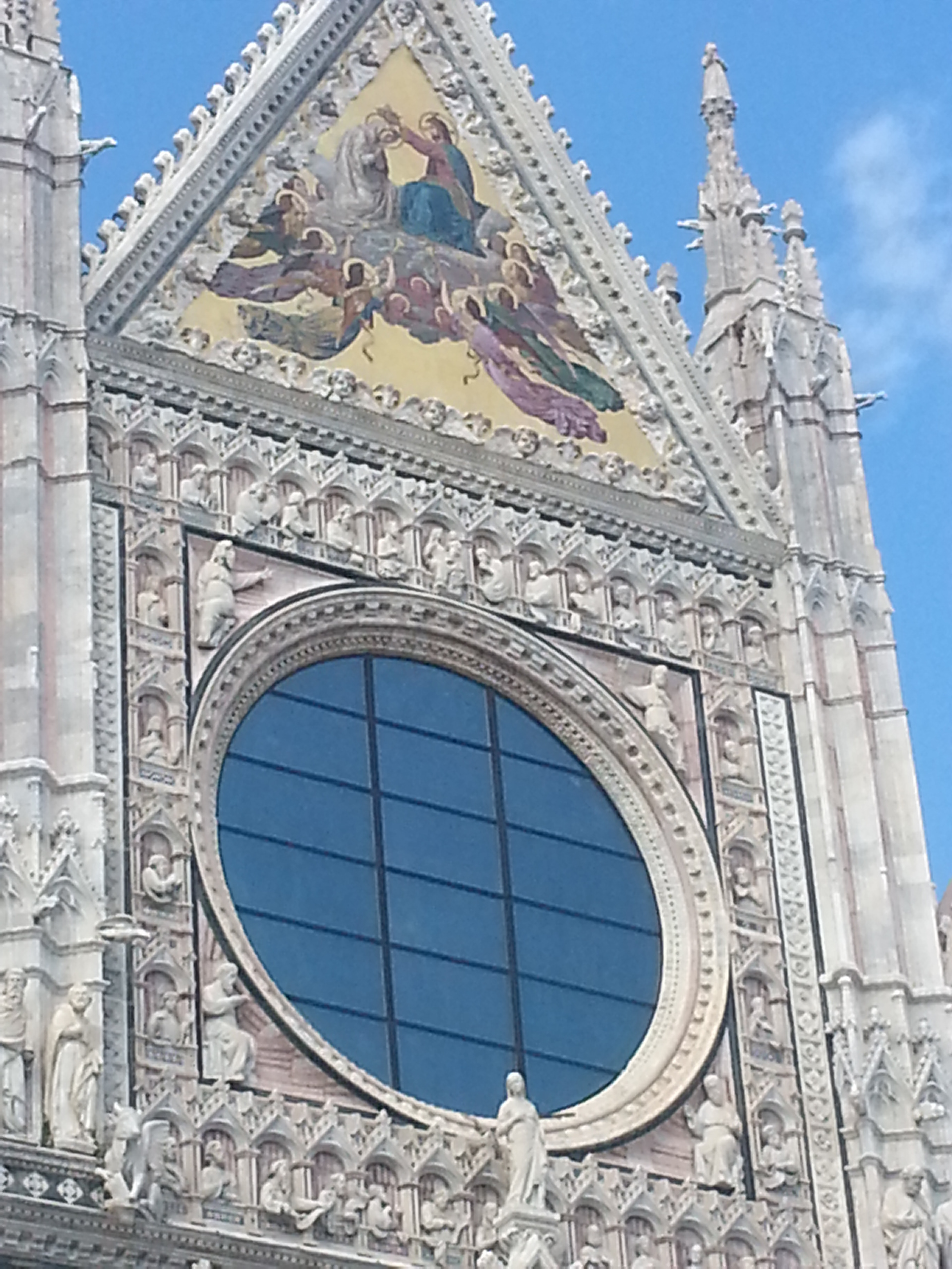 "Coronation of the Virgin” mosaic on facade of Duomo di Siena (Siena Cathedral), Siena, Tuscany, Italy 