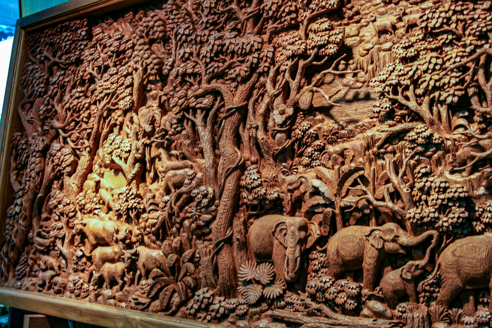 Wood carving at a Teakwood art factory.