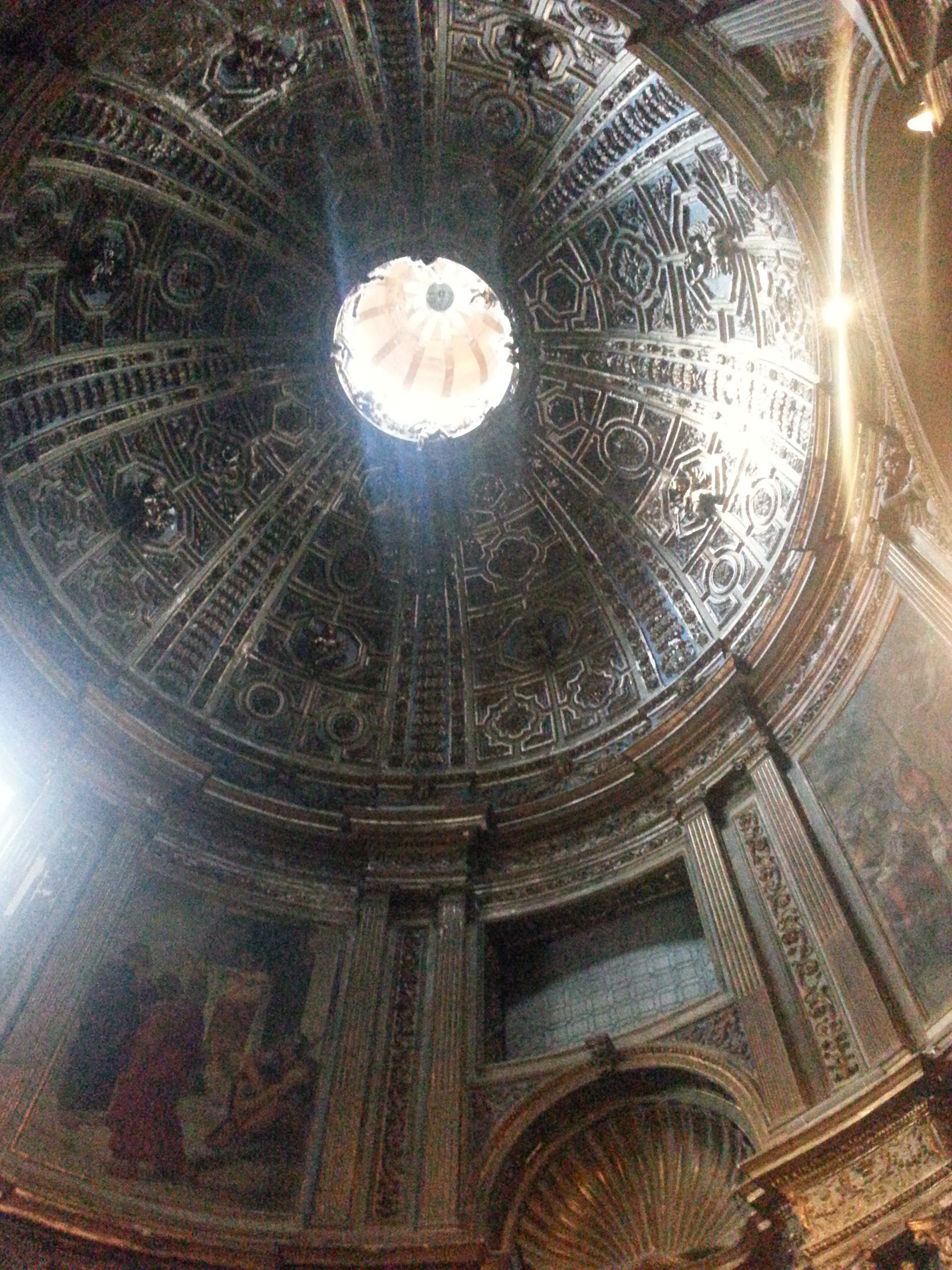 The gilded stucco dome of the Chapel of St. John the Baptist in the North (left) transept.