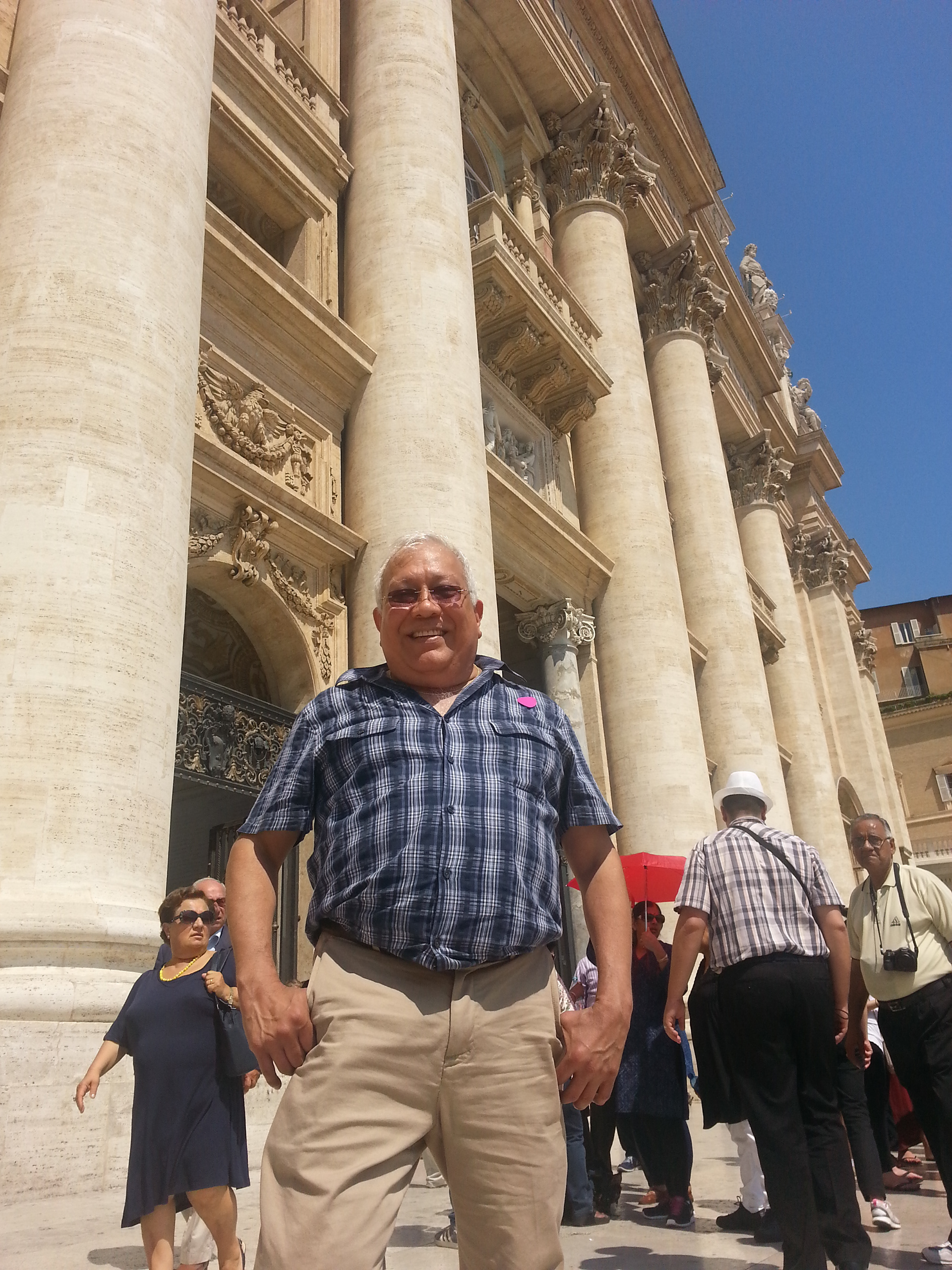 Sam Luna poses in front of the Pope's Balcony in St. Peter's Square.