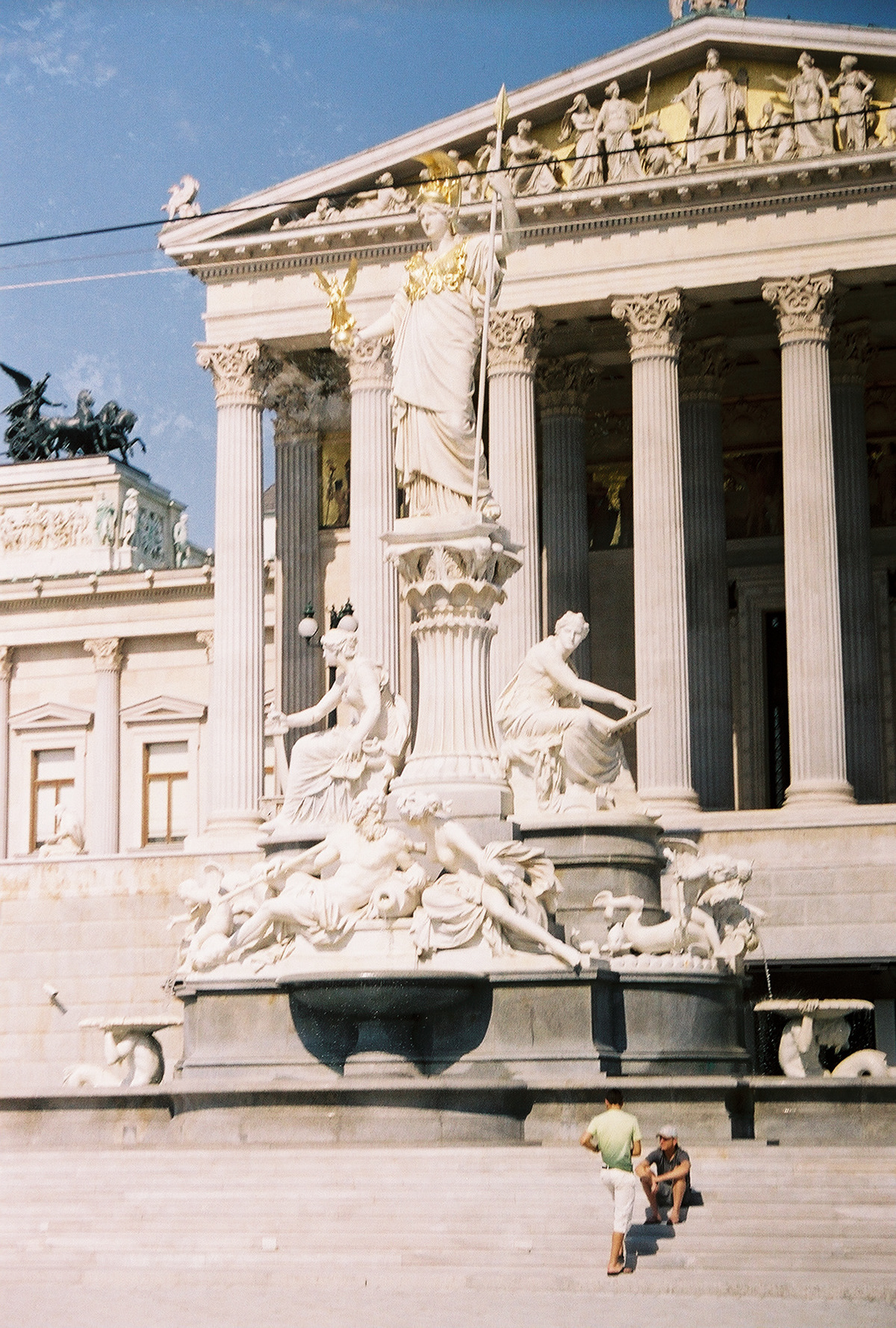 Statue and fountain of Athena-Pallas in front of the House of Parliament, Vienna, Austria.