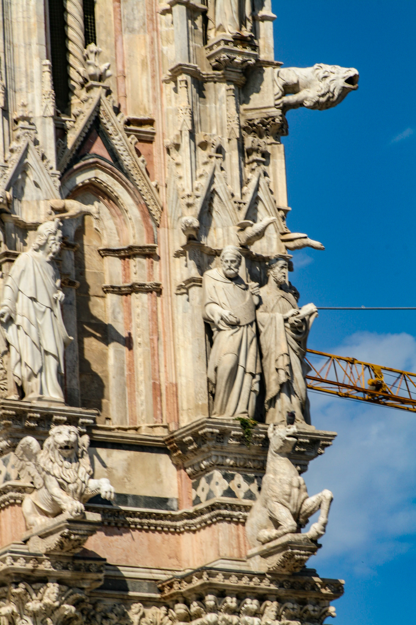 Gargoyles and saints on facade of Siena Cathedral, Siena, Tuscany, Italy 