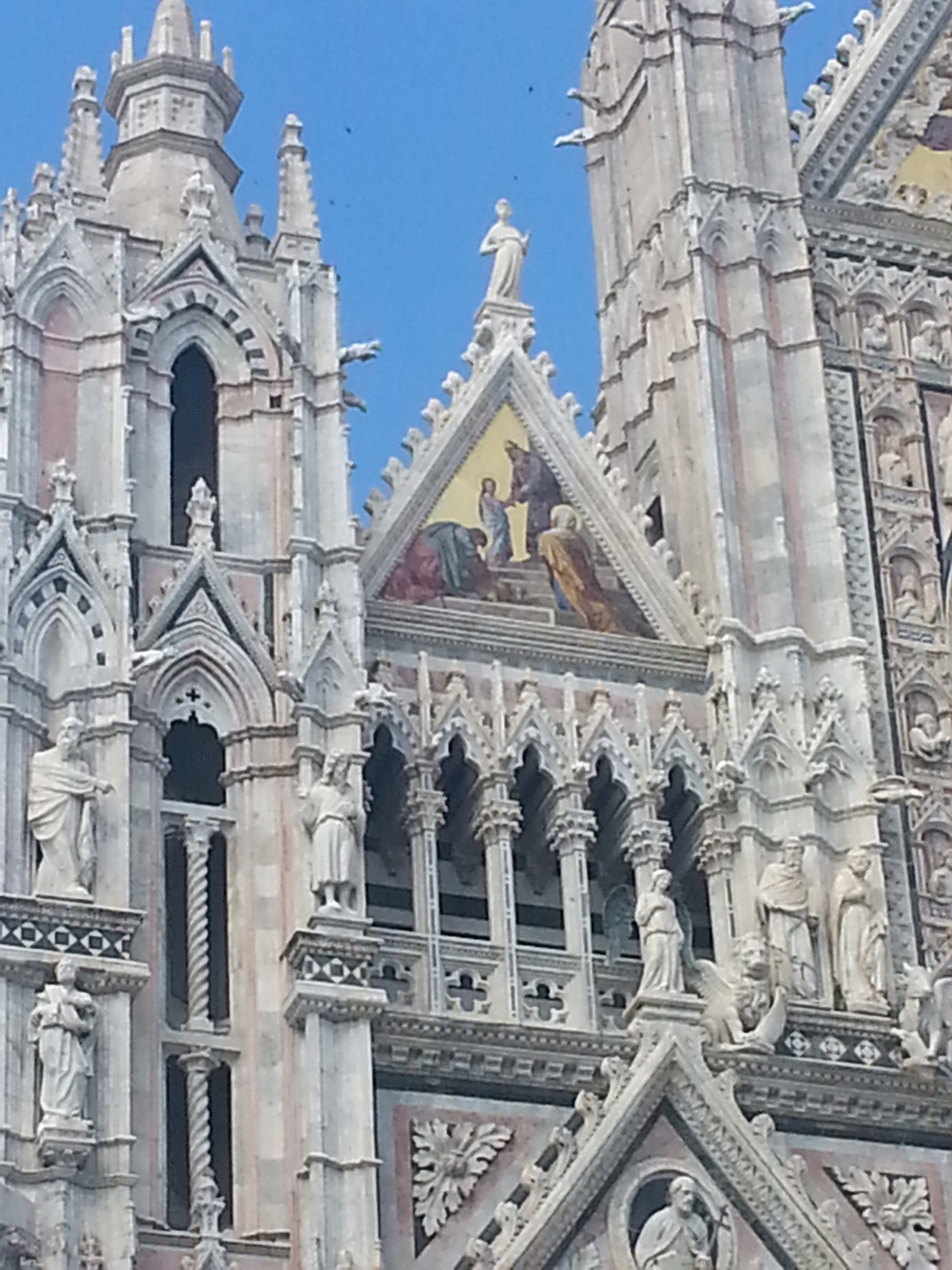 "Presentation of Mary in the Temple" gable mosaic on facade of Duomo di Siena (Siena Cathedral), Siena, Tuscany, Italy 