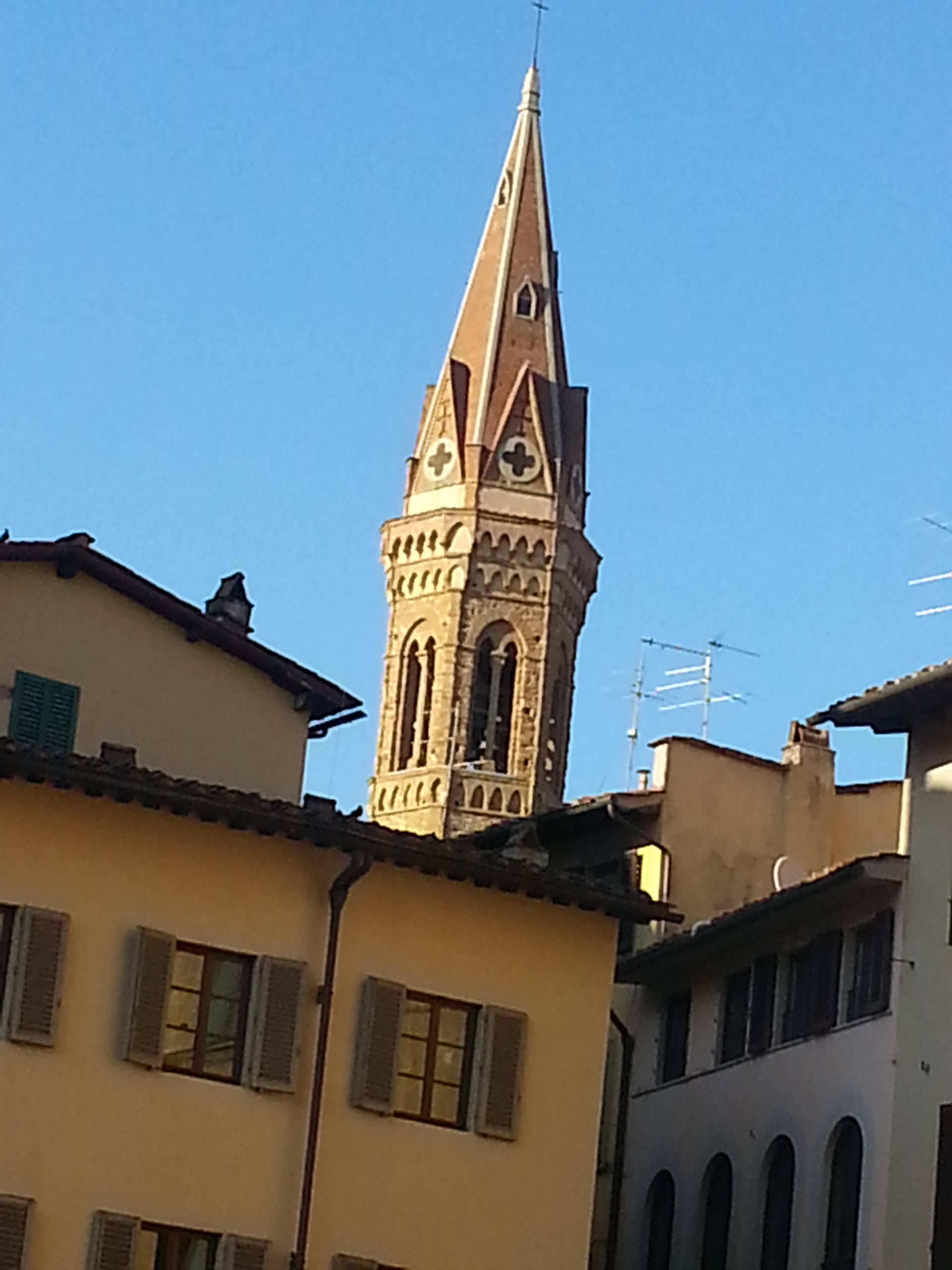 View of bell tower of Badia Fiorentina from Signoria square, Florence, Italy 