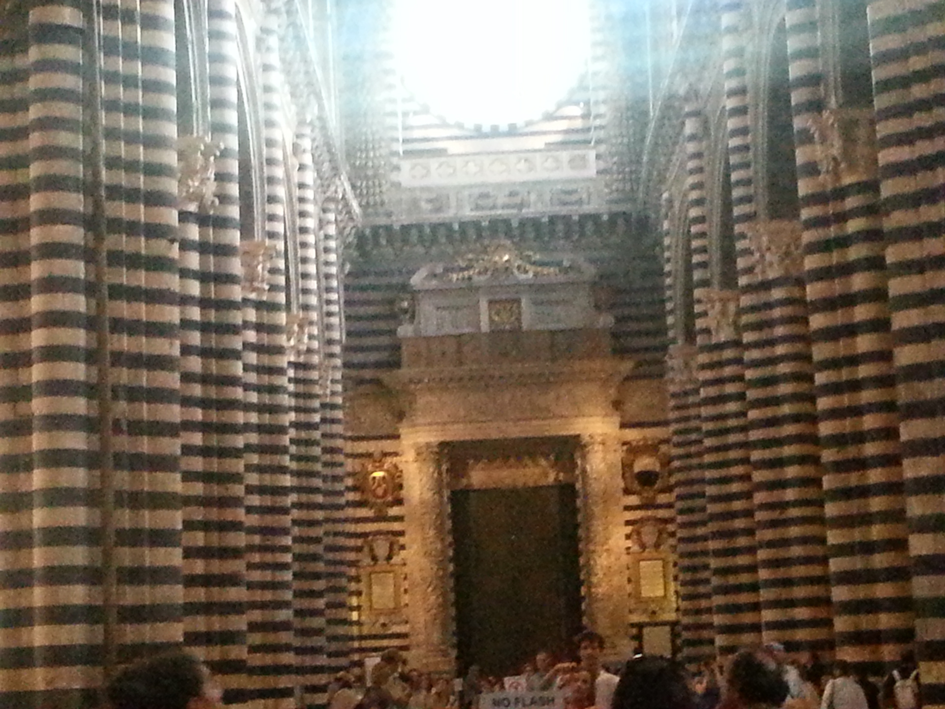 Most prominent feature of the interior of the Duomo are the black and white marble stripes on the walls and columns. Black and white represent the colors of the civic coat of arms of Siena.  