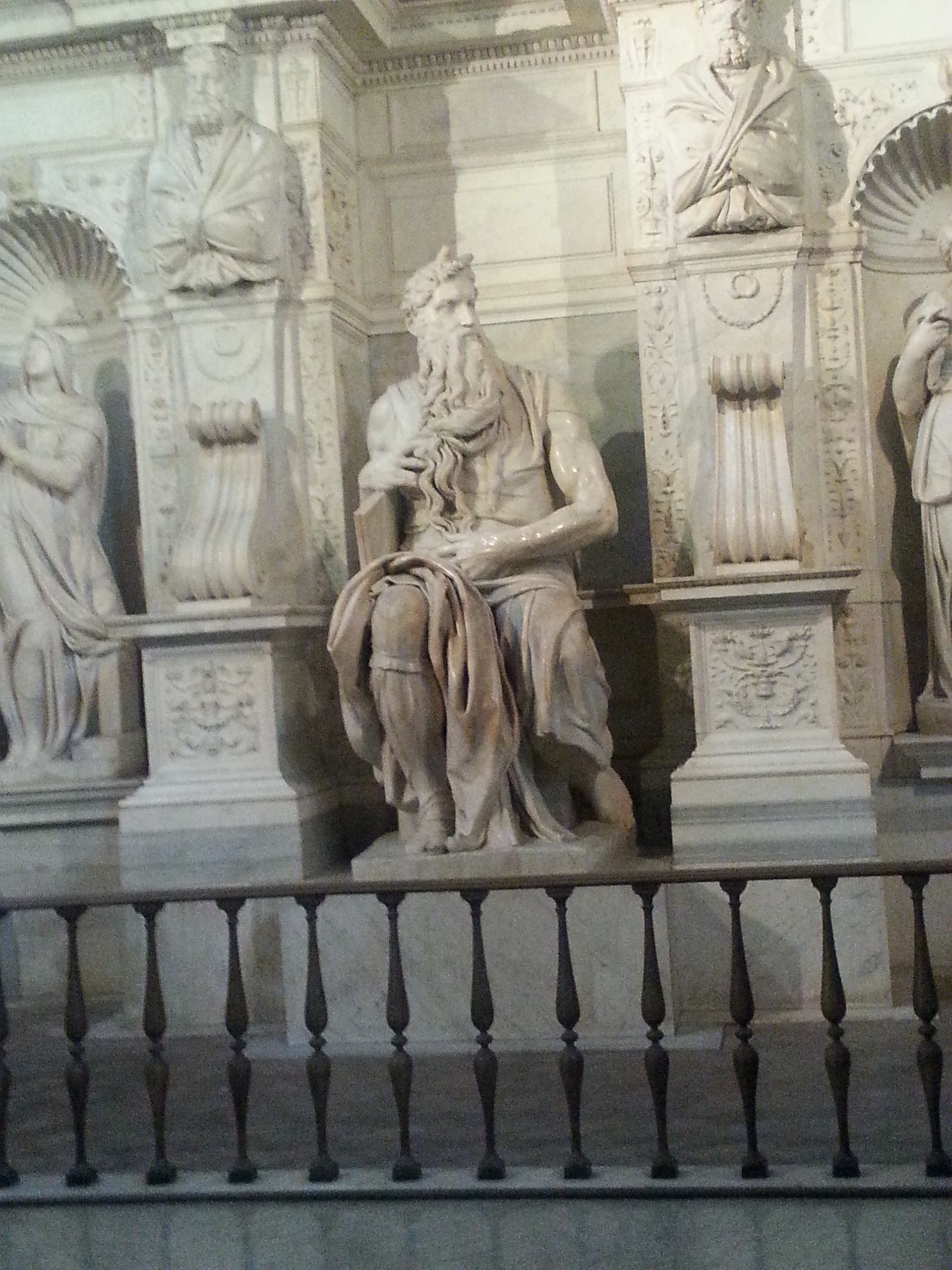 Moses (Italian: Mosè c. 1513–1515) is a sculpture by the Italian High Renaissance artist Michelangelo Buonarroti, housed in the church of San Pietro in Vincoli in Rome. Commissioned in 1505 by Pope Julius II for his tomb, it depicts the biblical figure Moses with horns on his head, based on a description in chapter 34 of Exodus in the Vulgate, the Latin translation of the Bible used at that time. 