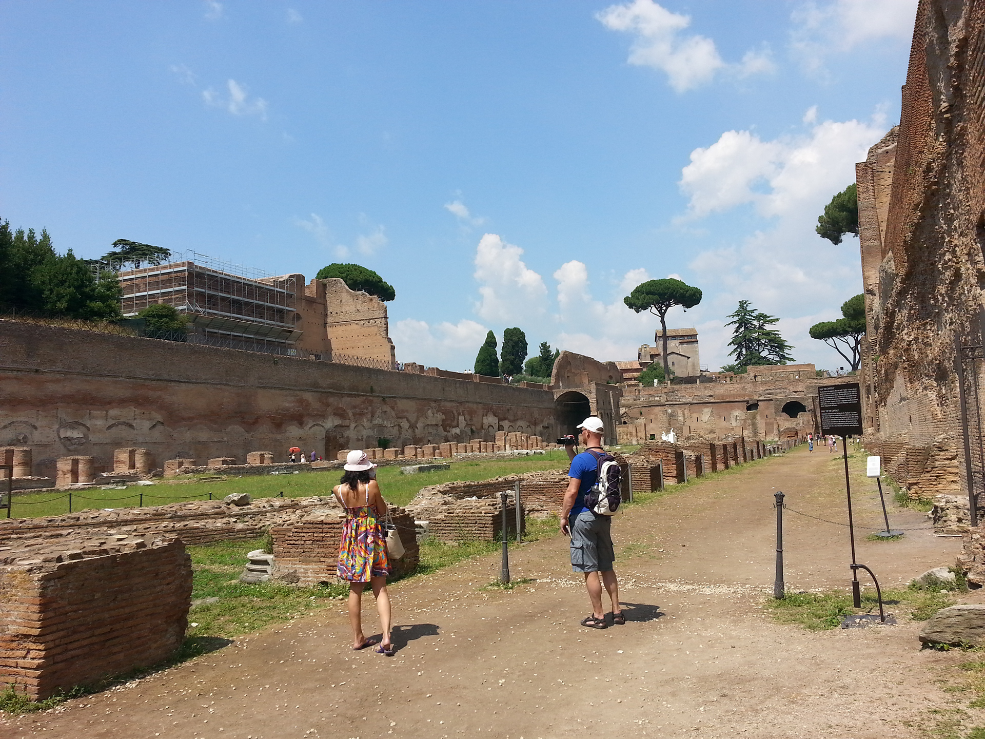 The Palatine Stadium was the third part of Domitian's palace on the Palatine Hill in Rome. It was the last to be built, after the Domus Flavia and the Domus Augustana, respectively the public and private parts of the complex. The stadium was a circus -shaped building, with a very elongated rectangle with a curved shorter side (the southern one) of about 160 x 48 meters. It occupies the entire eastern side of the Domus Augustana, for a total of about 88 meters. The perimeter was decorated by a two-story portico, composed on the lower level by brick pillars covered with marble (only the bases remain) and on the upper level by marble columns, as can be seen in part in the reconstruction of the northern corner. 