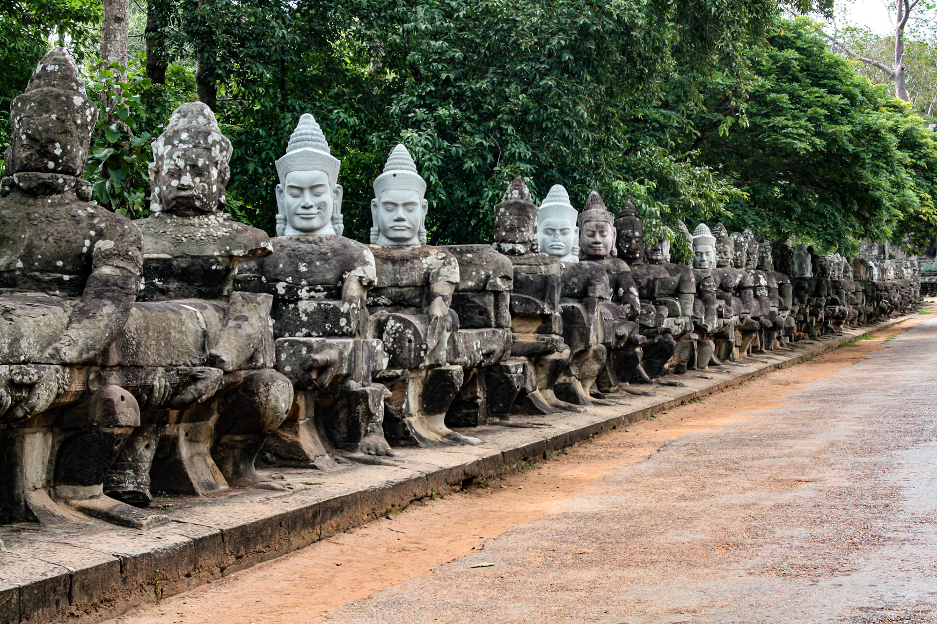 Ancient statues of gods at the South Gate of UNESCO s World Heritage Site of Angkor Thom, Siem Reap, Cambodia. 