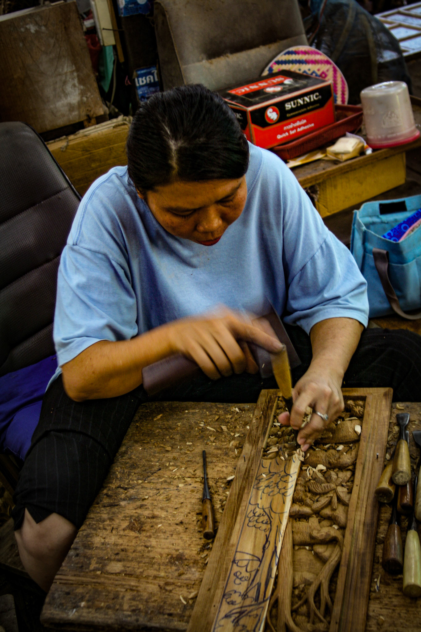 Wood carving at a Teakwood art factory.
