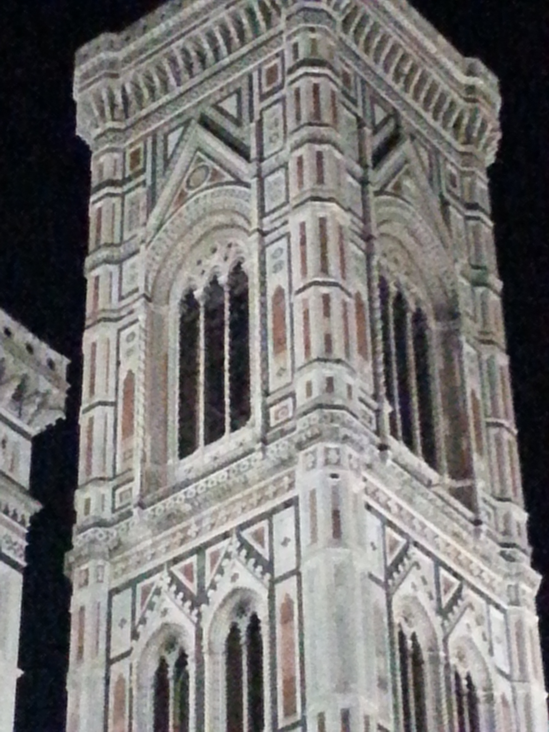 Adjacent to the Basilica is the towering Campanile (bell tower) designed by Giotto. 