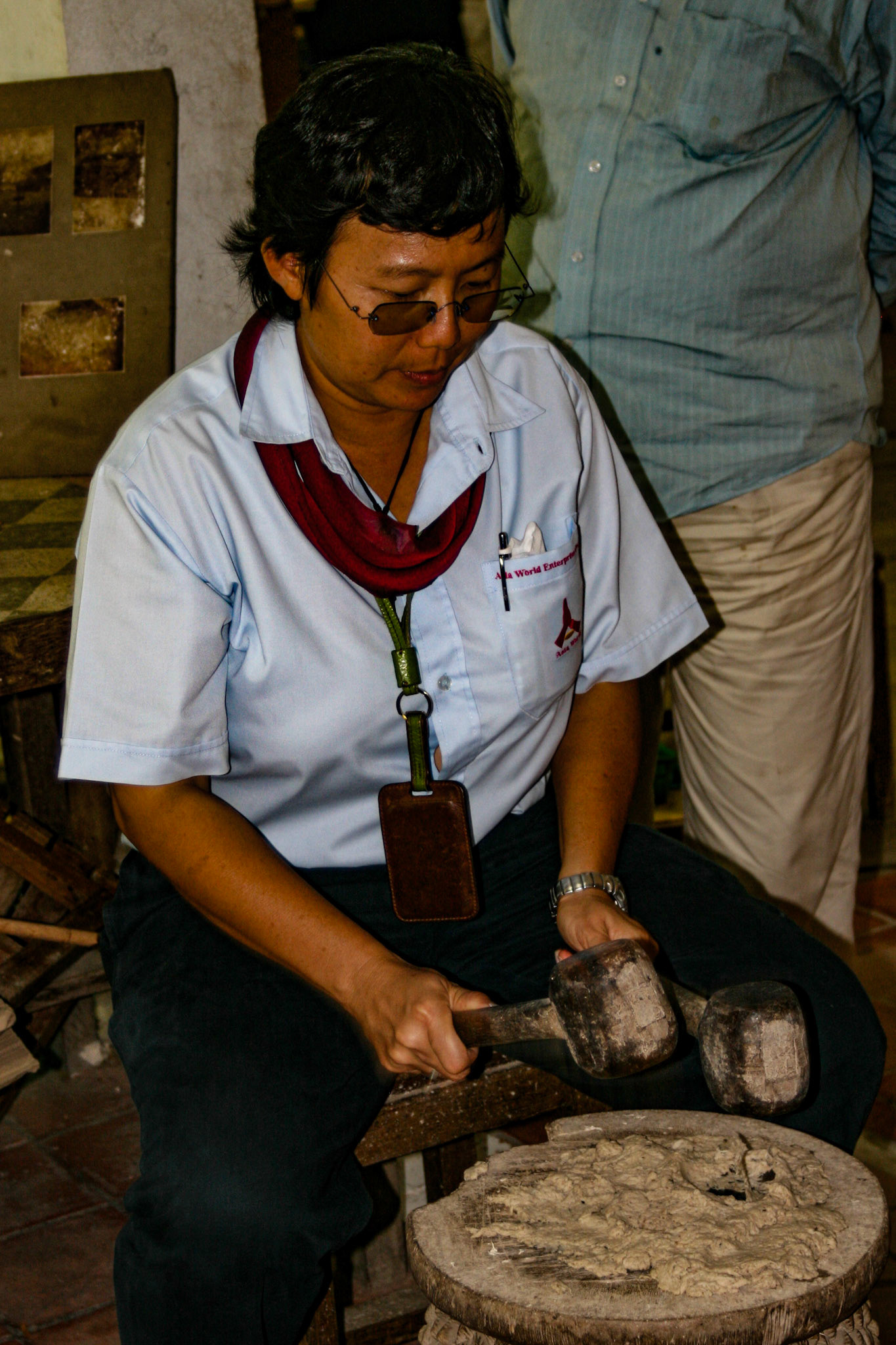 Nok, our tour guide tries out the sculpting hammers.