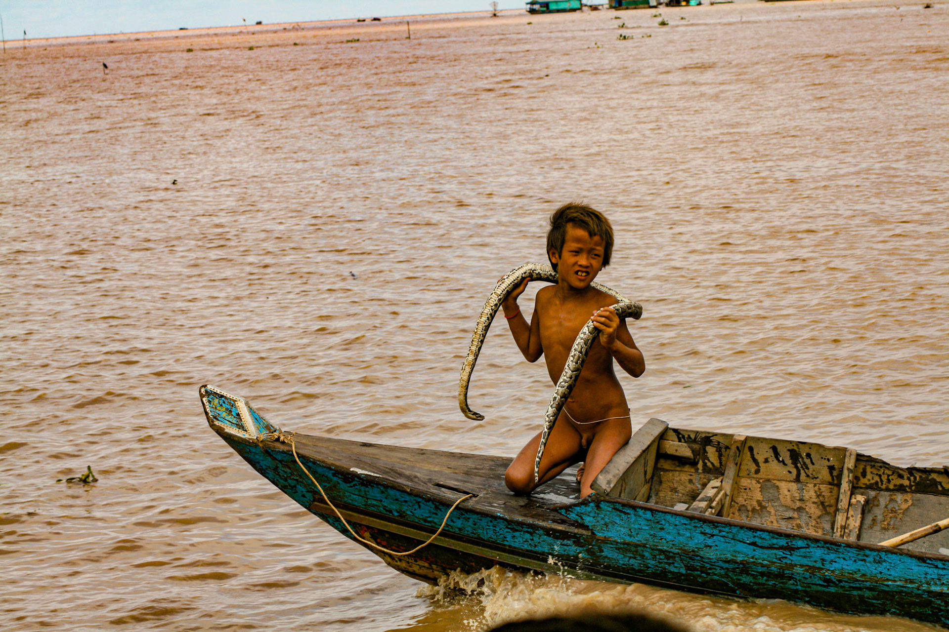 The locals have sometimes taken to bringing their young children up to the tourist boats to beg for coins. Some show off the biodiversity of the region—much to the chagrin of some tourists! 