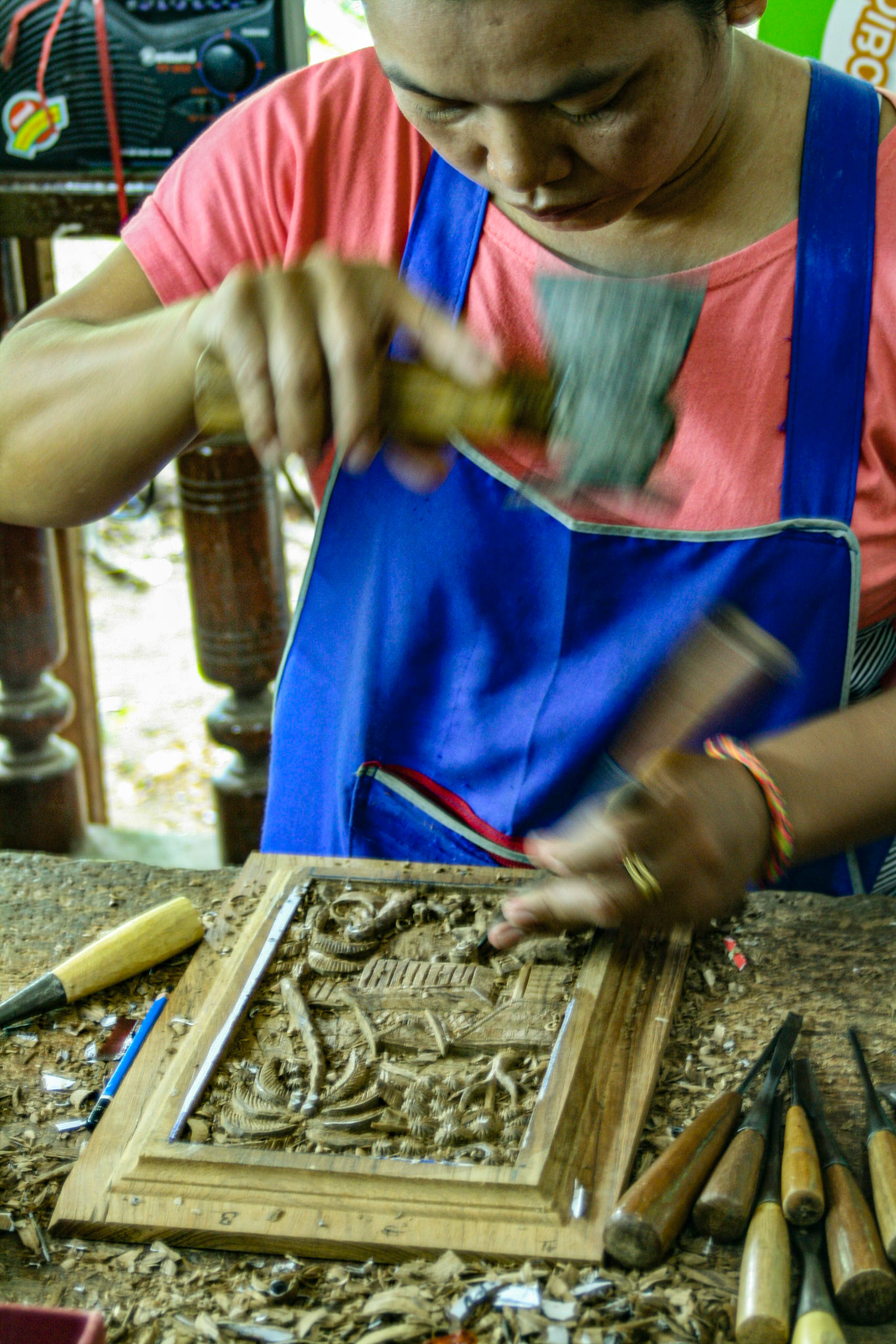 Wood carving at a Teakwood art factory.
