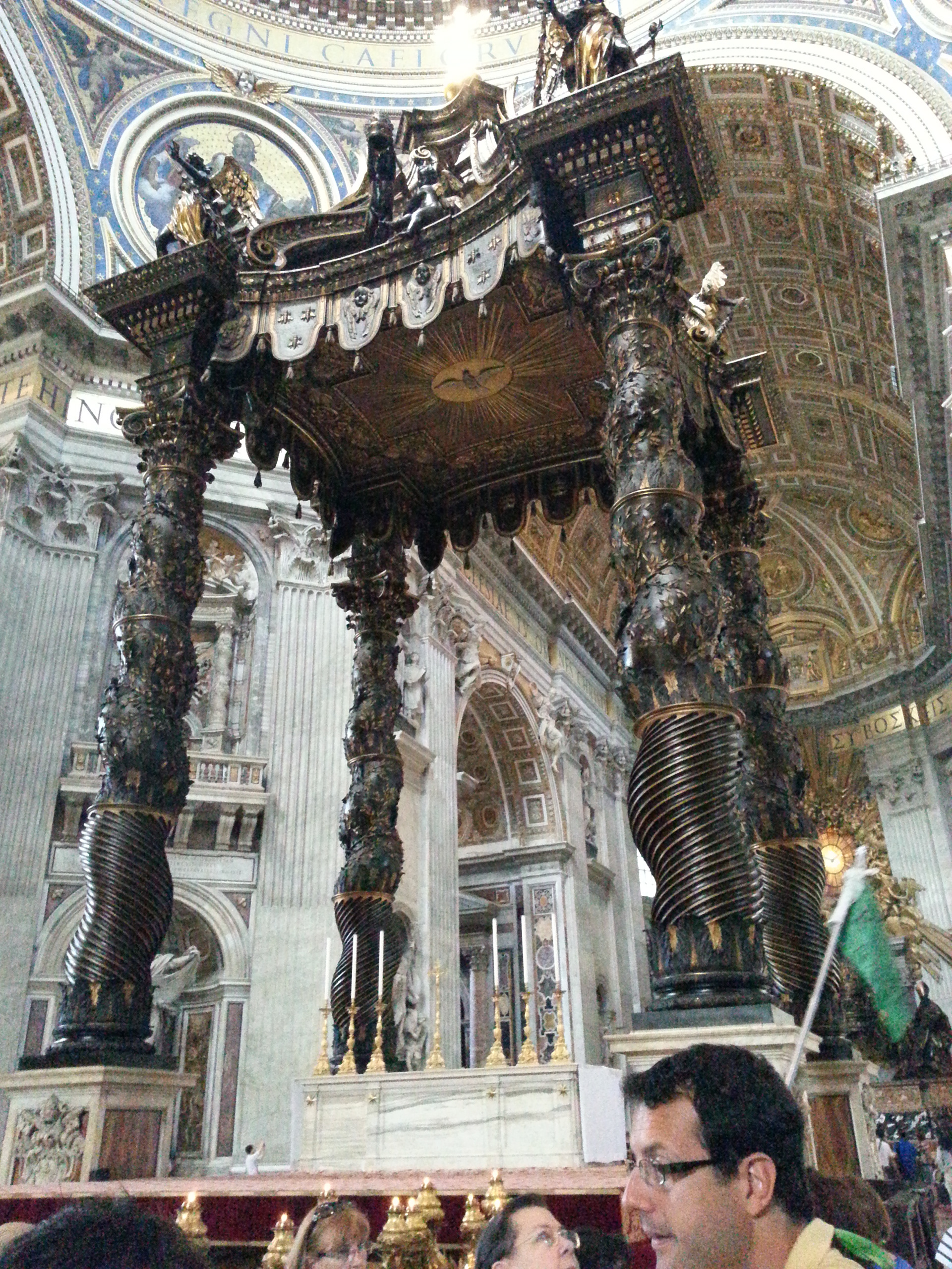 St. Peter's Baldachin (Italian: Baldacchino di San Pietro, L'Altare di Bernini) is a large Baroque sculpted bronze canopy, technically called a ciborium or baldachin, over the high altar of St. Peter's Basilica in Vatican City. Designed by the Italian artist Gian Lorenzo Bernini, it was intended to mark, in a monumental way, the place of Saint Peter's tomb underneath. Under its canopy is the high altar of the basilica. 