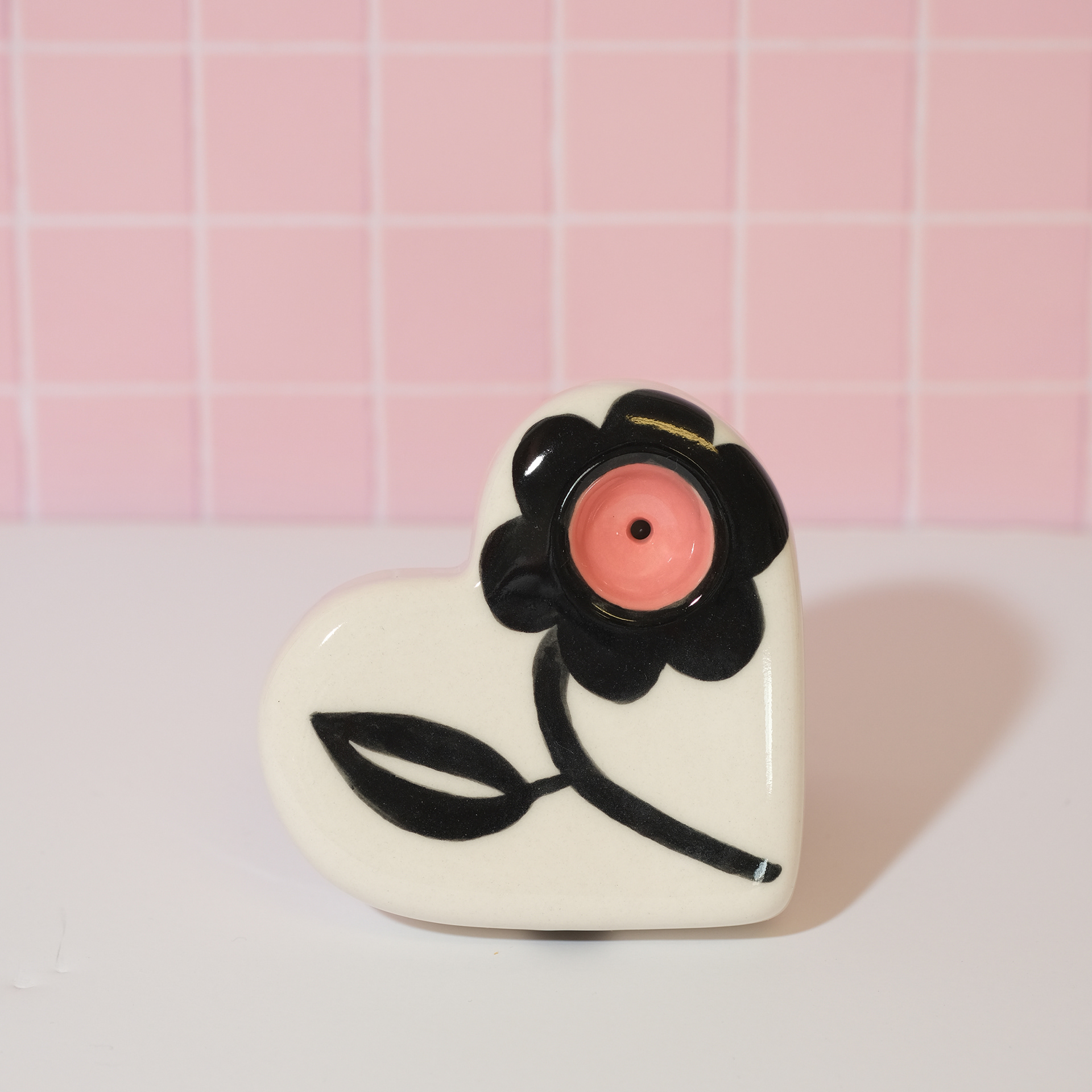 single flower heart shaped pink and black pipe