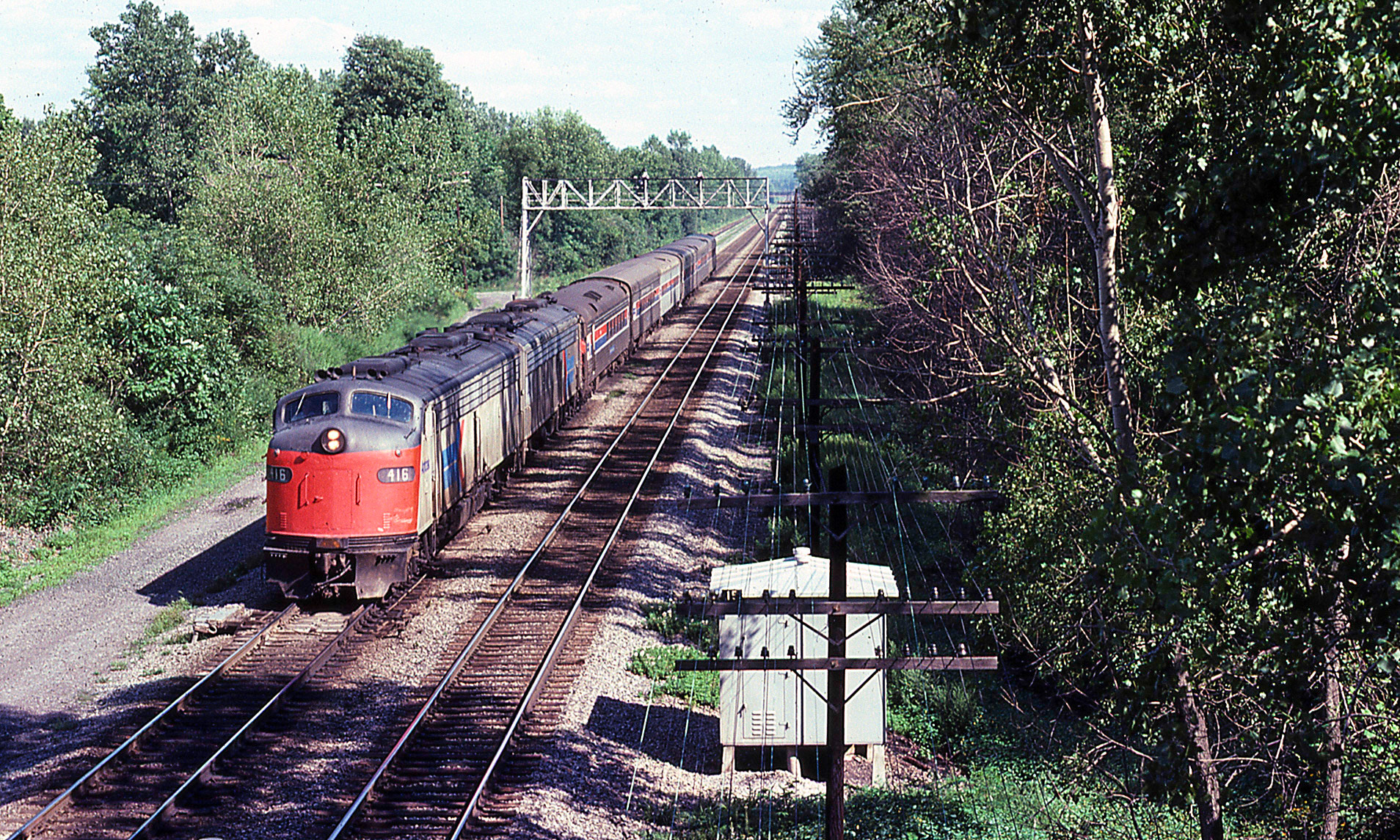 Amtrak westbound train 63 at CP15, Newark, N.Y. on Aug. 12, 1977.