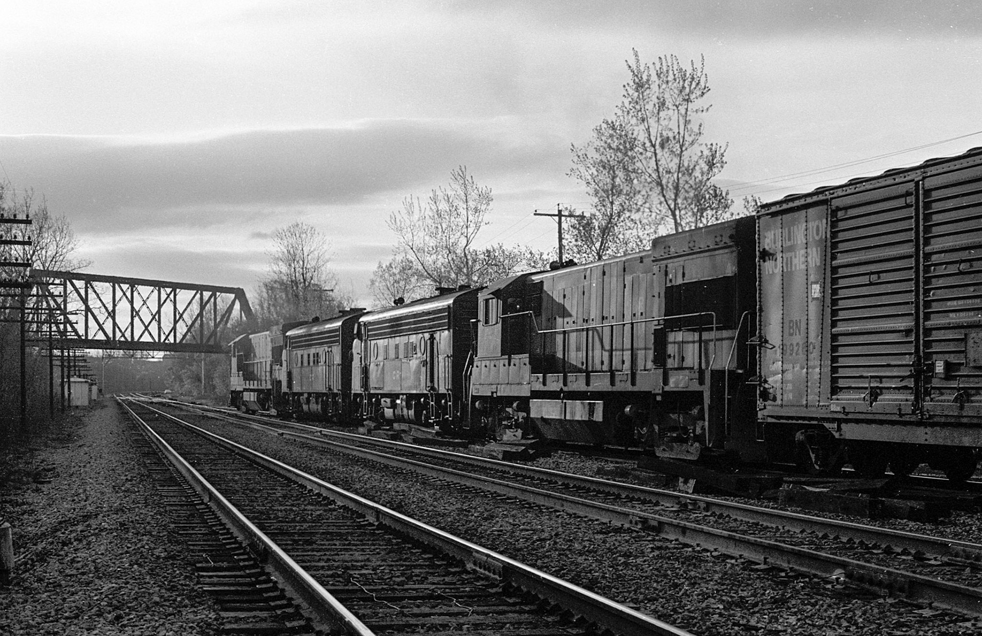 A westbound with two F-units enters the main tracks.
