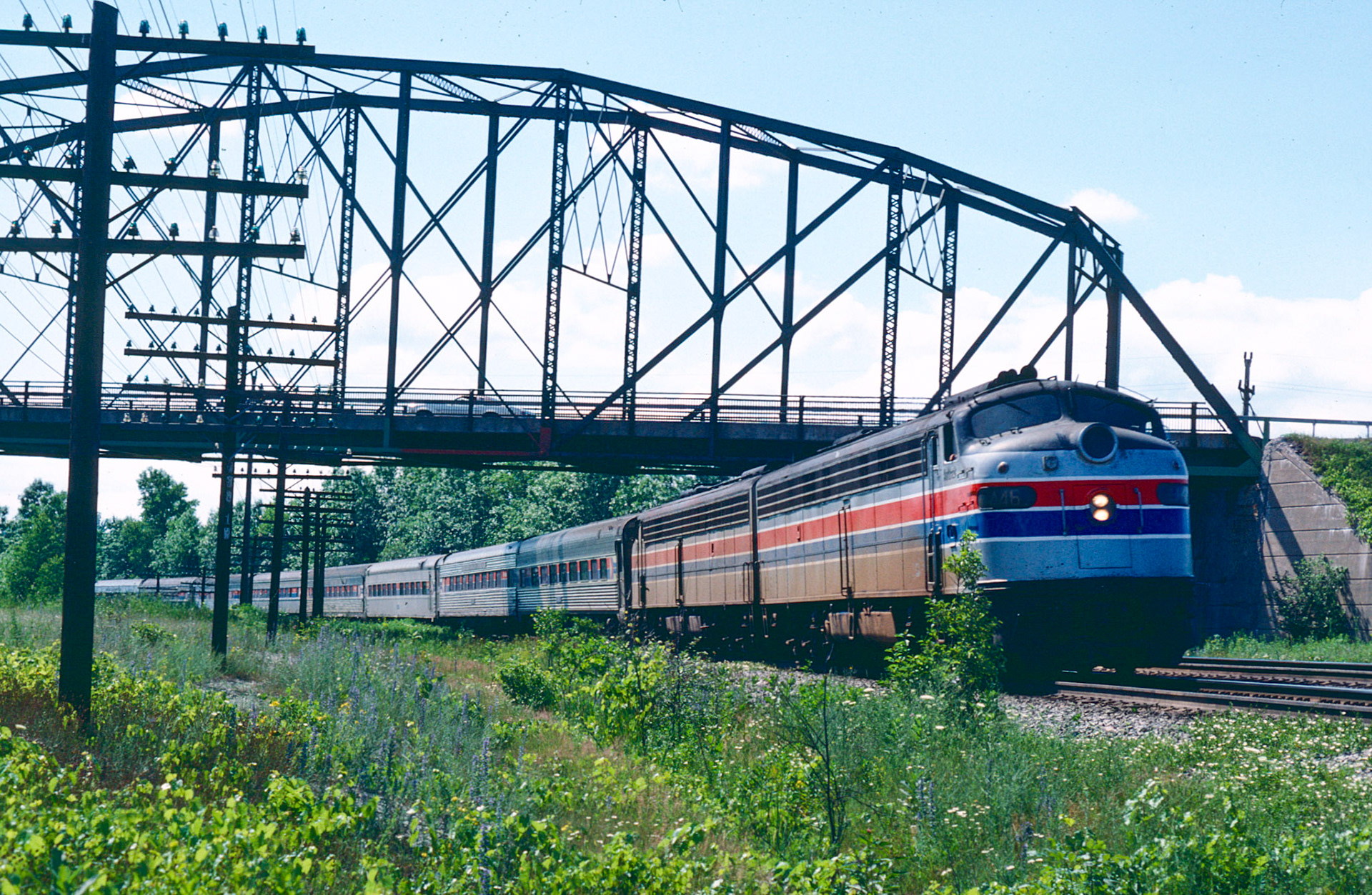 The eastbound Niagra Rainbow passes under the Rte. 31 bridge east of Newark at Blue Cut. The bridge was part of the Rochester, Syracuse and Eastern interurban line and was replaced in the 1980s.