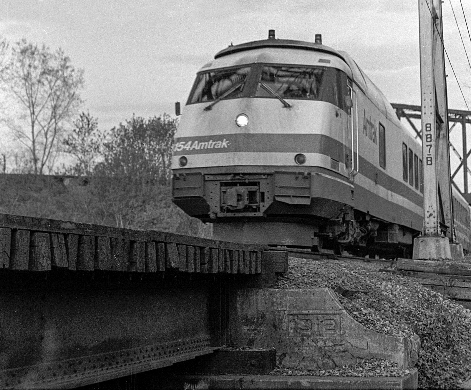 Westbound Amtrak Rohr turbotrain passes under the Marion branch just west of Newark, N.Y.