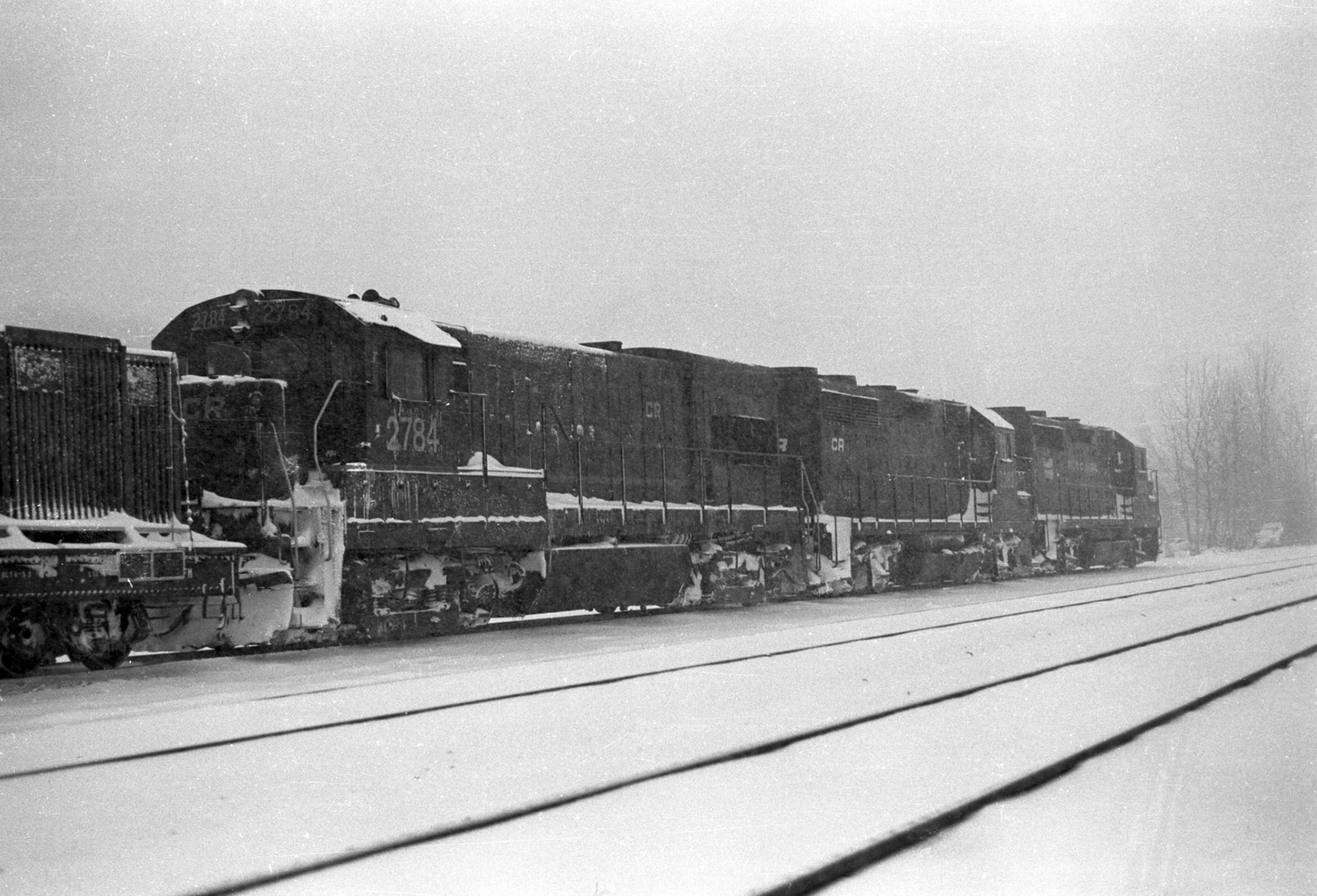 An eastbound Conrail freight dead on hours sits on the controlled siding at Savannah, NY, winter, 1979.