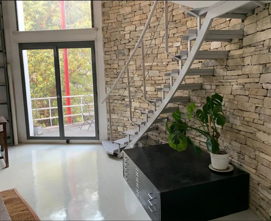 Figure 2.9: Franca. Interior View of Silo Stair. n.d. Airbnb. https://a0.muscache.com/im/pictures/miso/Hosting-3978081/original/27477fa5-6266-44e6-9908-aec48e77b9ba.jpeg?im_w=1200.