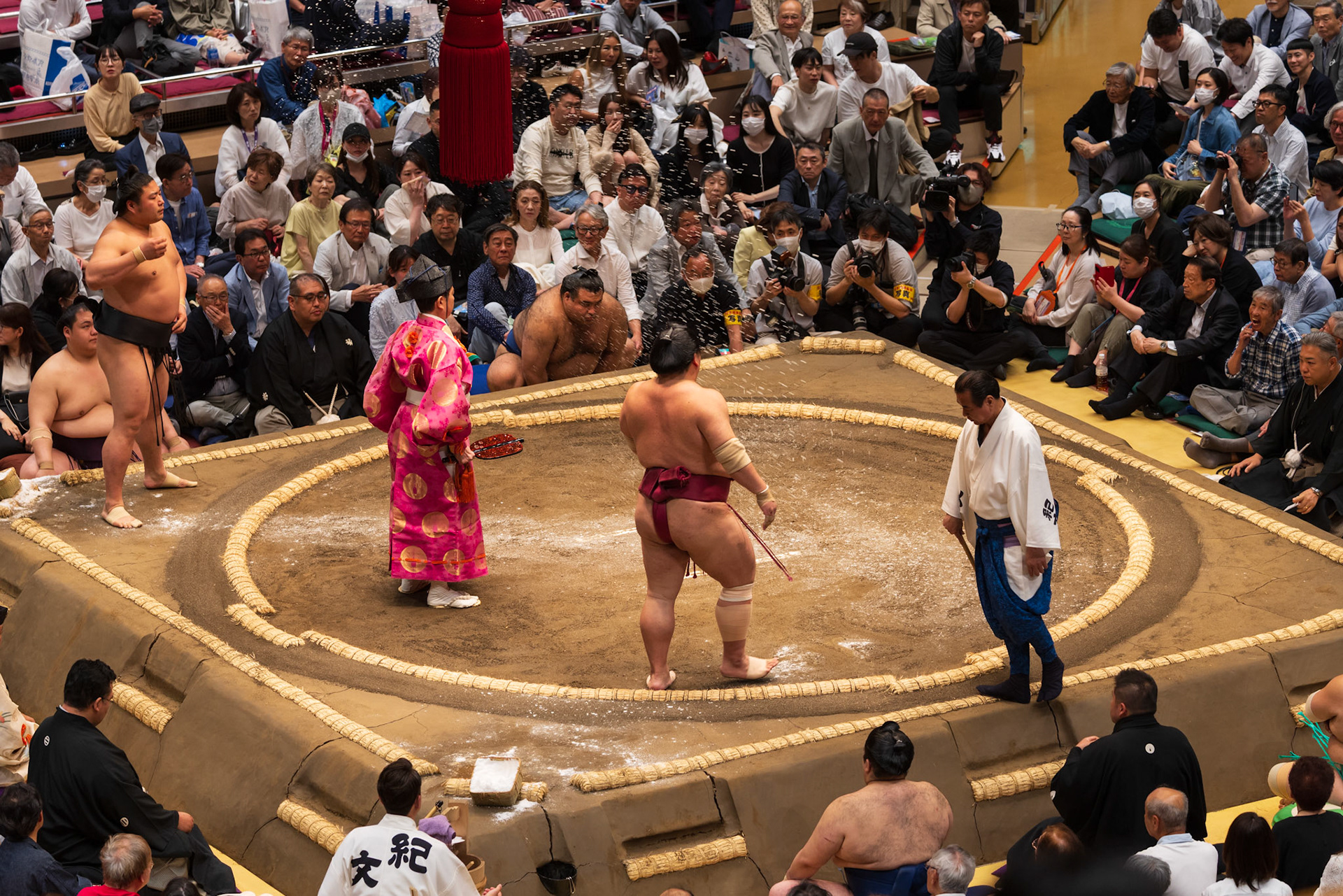 Wrestlers throwing salt before their match