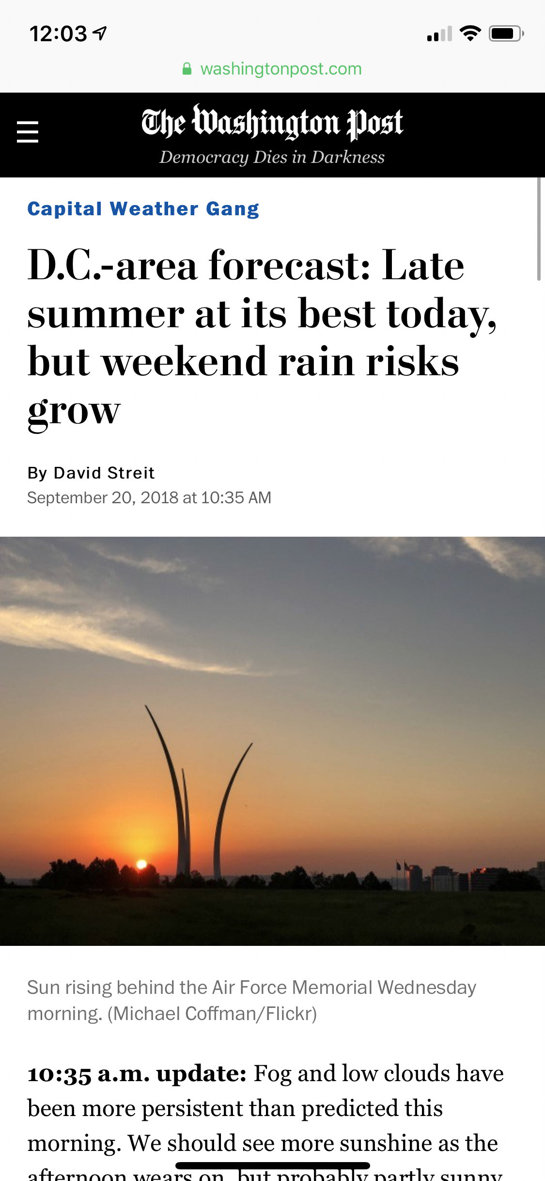 Sun rising behind the Air Force Memorial