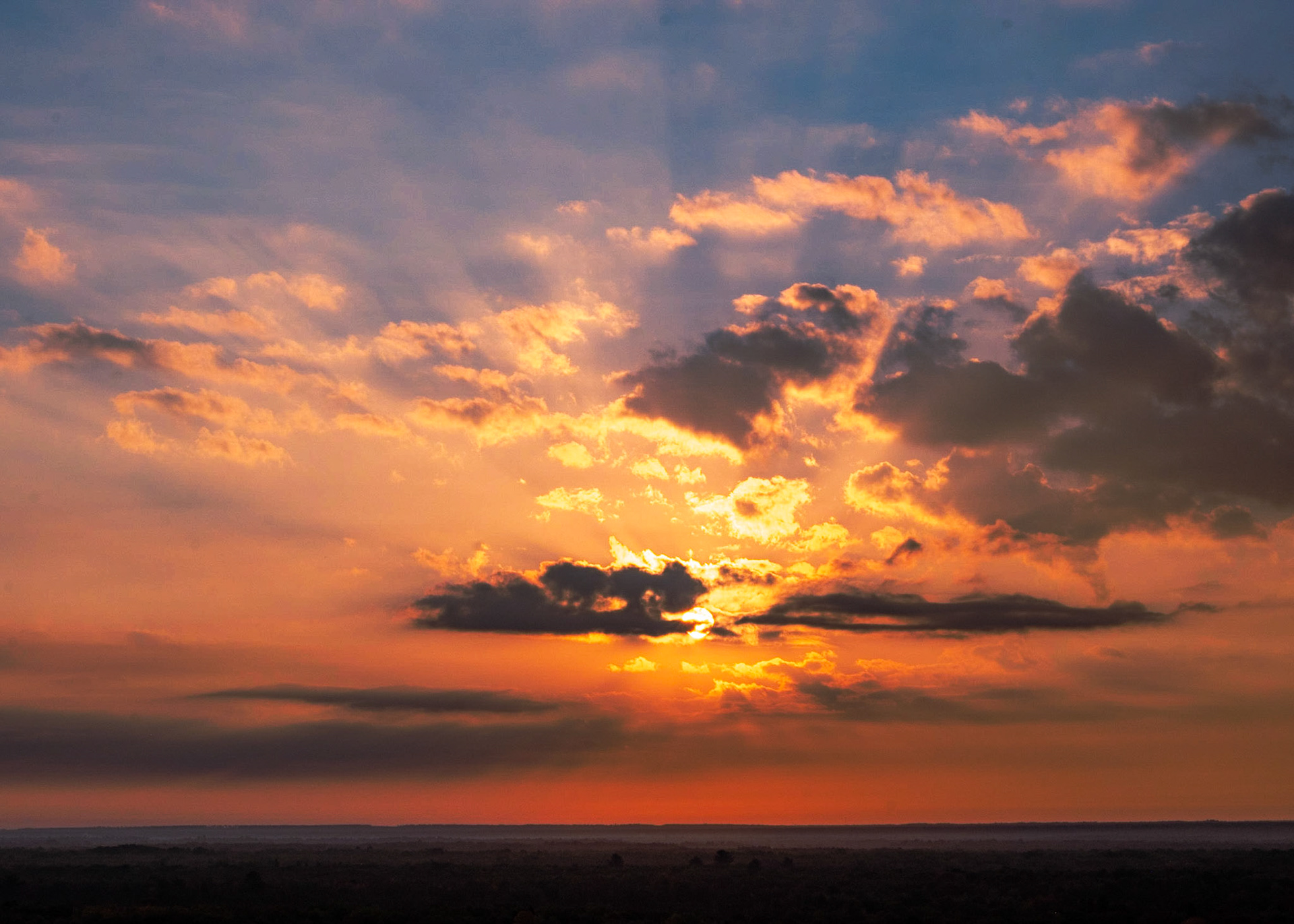 Well it wasn't the fall sunrise I wanted, but the sun through these clouds and the colors it was turning the sky was rather enjoyable to watch.