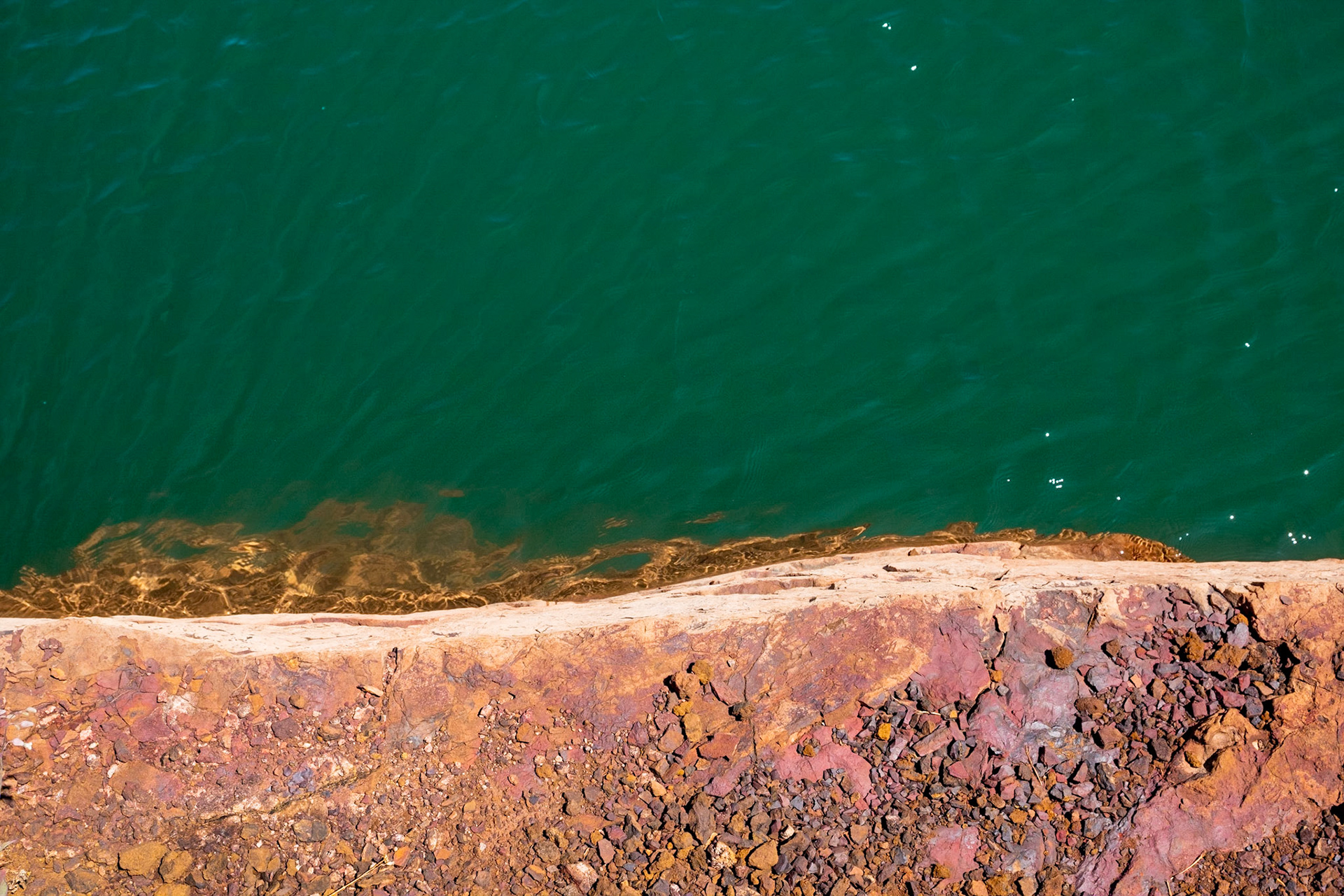 Those that grew up in iron country, know how this iron ore rock stains everything. But doesn't it look nice against this contrasting green water.   I'm trying to see iron in a cleaner way.