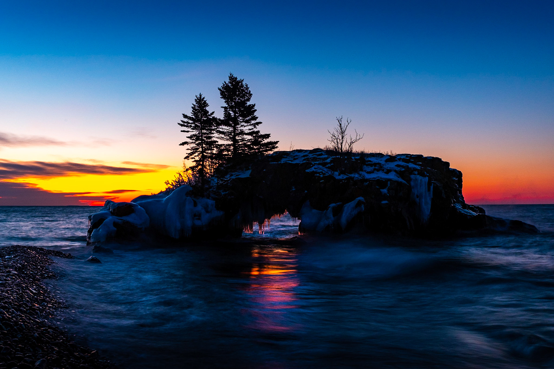 Why is a rock with a hole in it so interesting. I guess when you get light reflections like this it seems to make sense.