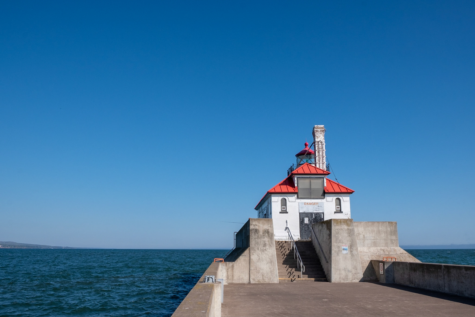 The Duluth peir lighthouse on a calm and clear day.