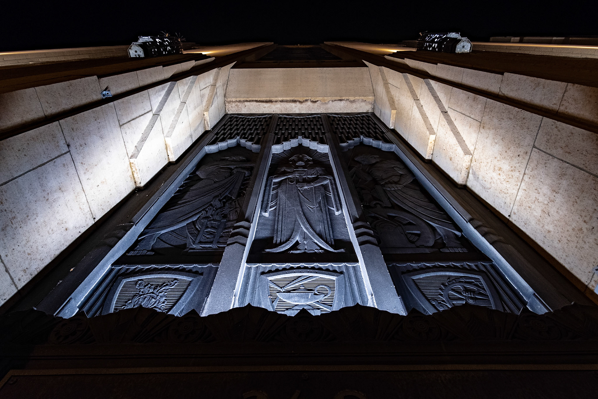 A great example of American Art Deco style from the 20's and 30's. They sure went all out on this sculpture that sits above their door.  Heat, Light, and Power are depicted in the three panels.