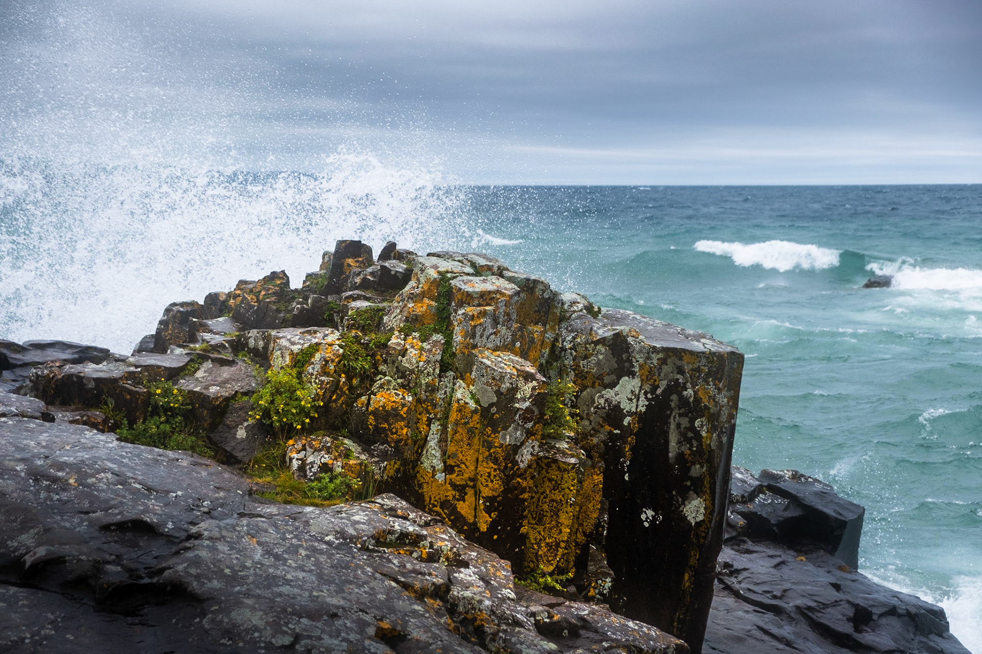 and yes, I got too close. So I was waiting for the splash to hit over this lichen covered rock, but I didn't take into account the large, and I mean bucket over head kind of splash that happend just off camera. I called it good with this photo after that.