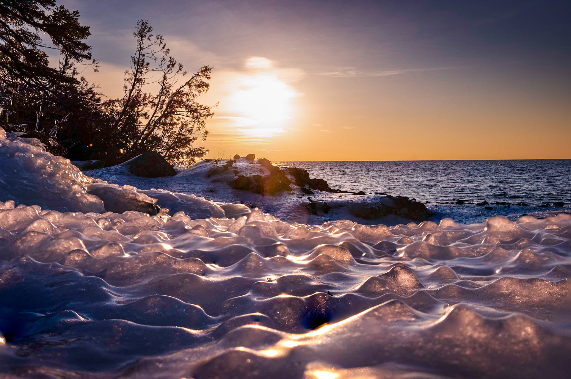 Nearby rocks covered in ice.