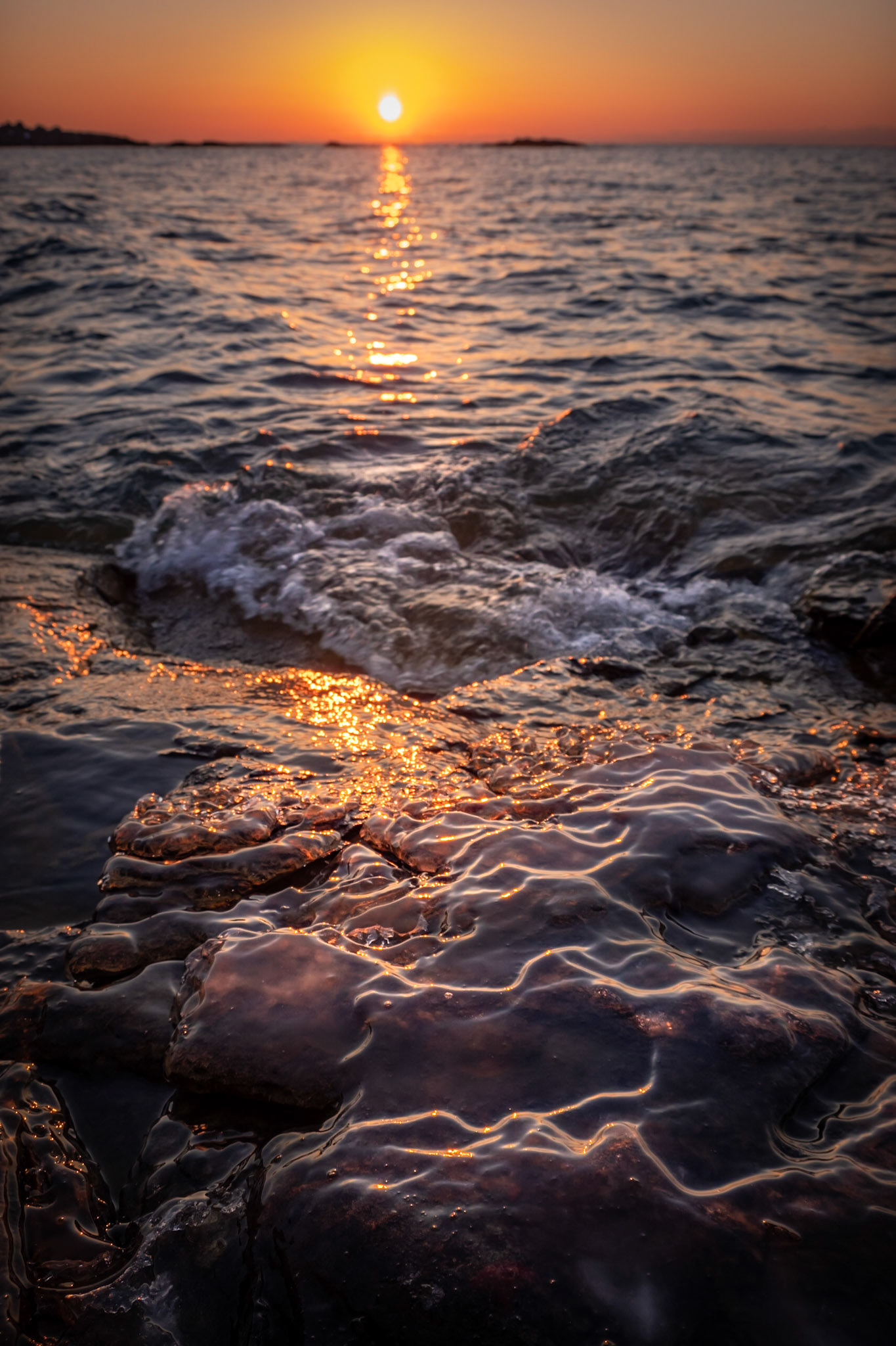 One of the best sunrise captures I've had. I actually got to sit down and comfortably watch the sunrise, while waiting for that moment the waves formed this V shape as it crashed on the rocks in front of me.